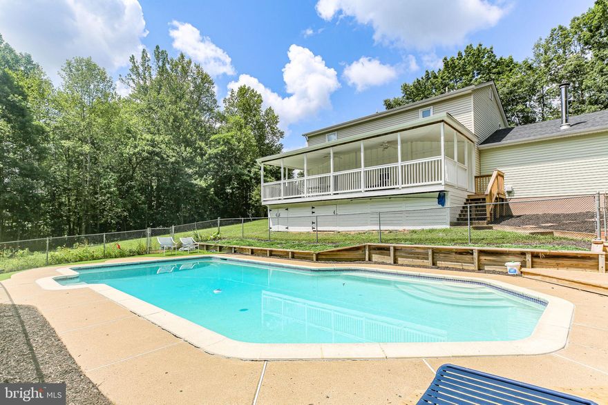 Welcome to Country Living at Its Finest! Bring the kids, bring the friends, bring the animals. Nestled on 3 stunning  mostly open acres, this fully renovated 4-bedroom home offers the perfect balance of privacy and convenience—just minutes from schools, shops, and everyday amenities.  Handsome white wooden fence on the exterior with a circular driveway and space for numerous vehicles. No Hoa! Inside, you’ll find stone core commercial-grade LVP flooring throughout, a beautifully updated kitchen with new cabinets, granite countertops, and stainless appliances (2022), living room and an extra large family room which can accommodate any sized furniture, with french doors to the exterior. Upstairs are the hard to find  4 true bedrooms plus a luxurious primary suite with a double shower. Enjoy outdoor living with a massive and very impressive 14x36 covered entertaining porch,  a 20x30 detached garage, and summer has arrived with a  20,000-gallon well maintained in-ground freshwater pool, a kid and adult delight and plenty of months in the season to still enjoy it.  This property has its  own mini orchard with apples, peaches, berries, grapes, and mint!  Additional features include a conditioned crawlspace, half-court basketball area, chimney hookup for a future woodstove, Wyze smart security system (cams, doorbell, spotlights, entry lock), and more.  A rare blend of comfort, freedom, and functionality! It is turnkey ready for your family, nothing for you to do but move in. Whether you are homesteading or just want the peace of country living, come check us out, we just might be the one.