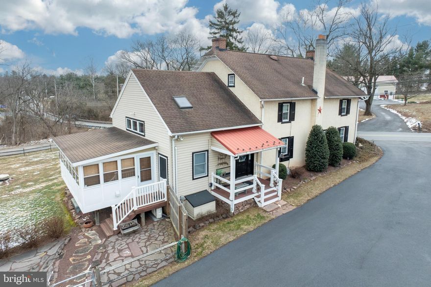 WOW!  That’s the only word to that comes to mind when viewing this property.  If you’ve been looking for a “family compound” with room for immediate & extended relatives, your search is over! Not only does this 2-acre property have a renovated ca. 1900 farmhouse w/approx. 3300 sq.ft. for the owners, but it also has an 8000 sq.ft. restored & beautifully renovated barn that functions as an Accessory Dwelling Unit (ADU) for relatives. This coupled with multiple outbuildings makes this a truly one-of-a-kind property in the Spring-Ford SD. Let’s take a tour of the farmhouse first. The covered porch leads you into the large living space w/pellet stove. The renovated kitchen in the farmhouse is gorgeous, w/hardwood floor, center island w/wood countertop, white cabinetry w/granite counters, stainless appliances, range hood & subway tile backsplash. Off the kitchen is the dining area w/hardwood floor & original walk-in fireplace w/insert. An enclosed sunroom off the living room & a half bath w/laundry closet complete the main level of the farmhouse. Upstairs, the primary suite has hardwood floors, a fireplace & a full en suite bath w/dual sink vanity & walk-in shower w/custom farmhouse shower door. 2 add’l bedrooms w/hardwood flooring share a hallway full bath. A large loft outside of the primary suite, walk-up attic & multiple closets providing plenty of storage space are also on the upper level. Finally, there is a temporary wall sectioning off a 1 Bed/1 Bath apartment from the rest of the farmhouse, which can be taken down by new owners if desired. Taking a walk to the rear of the property, you’ll find the massive ADU/converted barn. Inside the front door you’ll instantly be in awe. Hardwood flooring runs throughout the main level. To the right of the entry way are French doors leading to the den w/a stone accent wall. To the left of the entry way is the HUGE 2-story great room w/cathedral wood plank ceiling, propane gas fireplace, about a dozen windows for natural light, sliding door to the deck/balcony, and a dual curved staircase to upstairs. As you walk towards the heart of the home, you’ll notice the large dining room with an abundance of table space that is wide open to the kitchen. The eat-in kitchen in the ADU is a dream – gorgeous cherry cabinetry, granite counters, stainless appliances, large island w/5-burner propane gas cooktop w/stainless hood, double wall oven & stone accent wall. Through the kitchen is a large laundry room w/walk-in pantry. As you climb the curved staircase, you first land on an open loft area – the view down from above is AMAZING! The huge primary suite in the ADU has plenty of space for an abundance of bedroom furnishings. The en suite bathroom has a dual sink vanity, jetted tub w/custom surround, walk-in shower & wood look plank flooring. There is a large walk-in closet as well as another walk-in that could be a dressing area. There are 3 other bedrooms on this level that share another full bathroom, as well as multiple storage closets. Just when you think it can’t get any better – it does!  Down on the lower level, the first thing you see is the large “Summer Kitchen” area w/stone accent wall, tile flooring, dining area & sitting area w/propane gas stove.  Through the double bar doors, in the next room you’ll find a large living space, pool table, and built-in wet bar. Continuing through another set of double barn doors is yet another gathering area, a bedroom and a full bathroom w/custom farmhouse vanity. AND most everything you see in the ADU is included in the sale! The exterior of this property offers not 1, not 2 but 5 total outbuildings, including a 1 bay garage, multiple storage sheds & a 2-bay garage/workshop for smaller vehicles, such as motorcycles and ATV’s. Conveniently located in Limerick Township, this property is just minutes from great shopping areas and major roadways. This is the unique property you’ve been looking for!