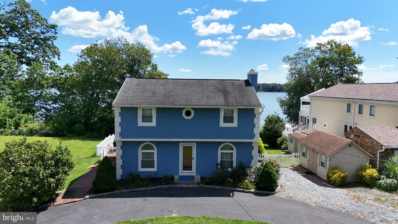 Welcome to your dream waterfront retreat at 4017 East Baker Avenue in Abingdon, MD! This charming 3-bedroom, 2.5-bathroom home offers over 2,400 square feet of beautifully designed living space and breathtaking views of the Bush River. The heart of this home is its stunning recently renovated kitchen. It features stainless steel appliances, a farmhouse sink, induction cooktop, double wall oven, microwave drawer, granite countertops, and an impressive 12-foot island. The cozy living area with a fireplace is perfect for relaxing. The upstairs primary bedroom includes a convenient en suite bathroom for your comfort and privacy. The finished lower level boasts a club room, ideal for entertaining. Step outside to enjoy your wrap-around, no-maintenance rear deck, plus upper and lower decks that lead to a 100-foot pier with 3 slips, a boat lift, and full utilities—perfect for boating enthusiasts! Additional amenities include a fenced backyard with two sheds. This home is walking distance to the Bush River Yacht Club, and close proximity to APG , I-95, and Bel Air. Recent updates include multi-zoned HVAC (2024), kitchen renovation (2023), electric fireplace (2023), LVP entire first floor (2023), new front and back doors (2022), new bay window ( 2021), basement carpet (2021) . No HOA and no flood insurance required! Don't miss out on this unique waterfront property!