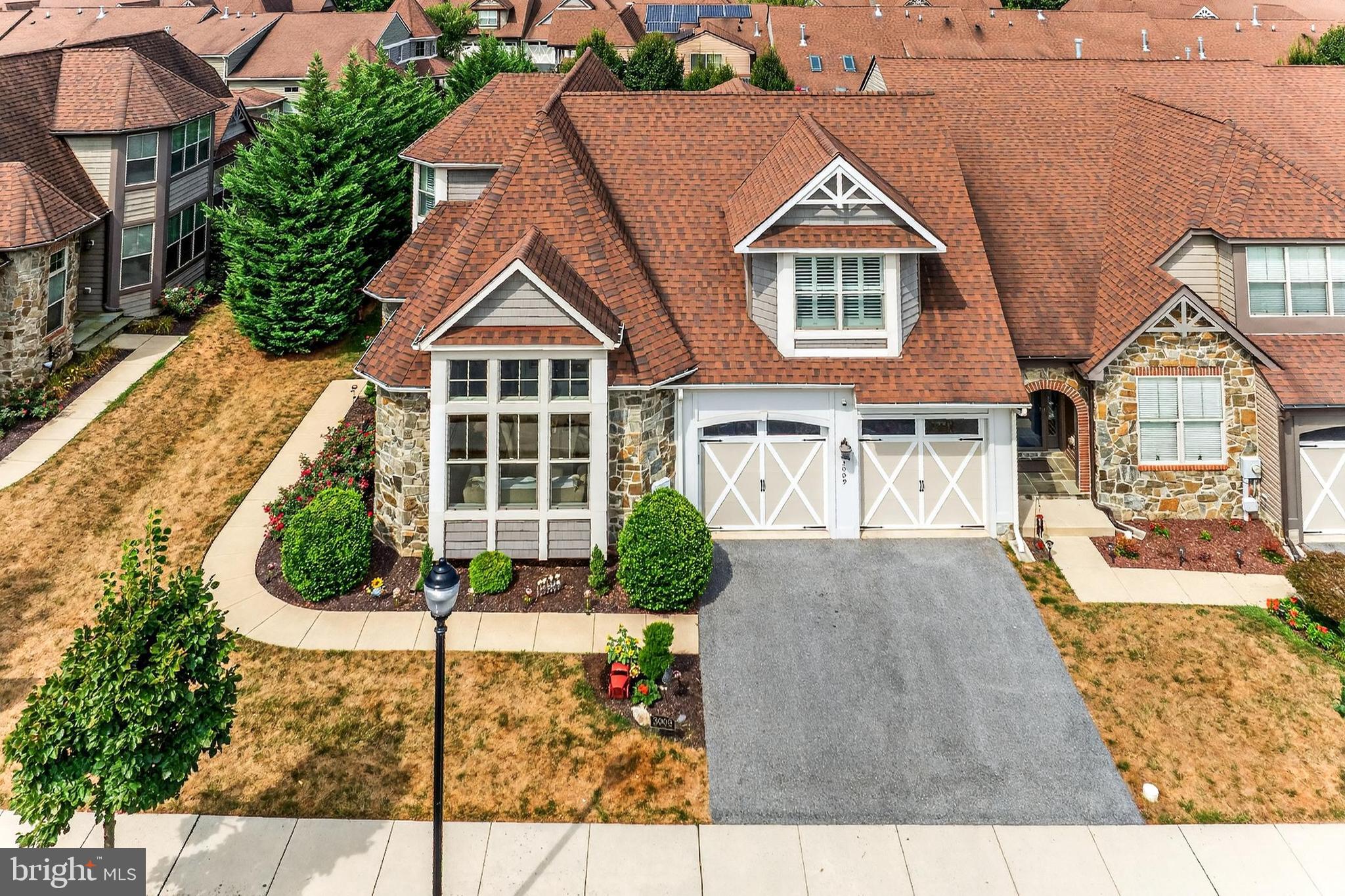 Fall in Love with this Stunning Foxhall End-Unit Villa!
Welcome to this absolutely breathtaking 11-year old Foxhall end-unit villa in the highly sought-after Mill Island section of Worman’s Mill—a home where every imaginable upgrade has already been done for you. From the moment you arrive, you’ll be impressed by the beautiful exterior stone front that sets the tone for the elegance inside. Freshly painted throughout, this beauty is truly move-in ready and offers an estimated 4,090 finished square feet (with tax records showing 3,665 finished square feet).
Main Level Elegance
Step into the grand foyer and you’ll be captivated by the attention to detail and luxurious finishes. The main level features luxury vinyl plank flooring throughout, a turned staircase with decorative metal balusters, and a recessed, lighted art niche. Just off the foyer is a powder room and a private office/den with upgraded moldings, oversized windows, an elegant angled ceiling, and a motorized shade—perfect for comfort and convenience while working from home.
The formal dining room impresses with plantation shutters, upgraded trim, and recessed lighting. The show-stopping kitchen will leave you speechless:
Premium cabinetry with glass doors and lighted display cabinets inside
Granite counters & marble backsplash
High-end stainless-steel appliances with gas cooking
Under-cabinet lighting and a thoughtful overall lighting package for the perfect ambiance
The two-story great room features custom built-ins, a beautiful trim package, plantation shutters, and an accent gas fireplace. Adjacent, the sunroom offers walls of windows with plantation shutters, serene backyard views, and easy access to the outdoor living space.
Outdoor Paradise
Step outside to your private backyard oasis with extensive hardscaping, privacy fencing, and additional trees for shade. Evening gatherings are magical with the integrated landscape lighting.
Main Level Primary Suite
The primary suite offers a lighted tray ceiling, recessed lighting, and a spacious customized walk-in closet. The luxurious en suite bath features ceramic tile, a jetted tub, and a multi-faucet shower system. Even the laundry room is upgraded with cabinetry, storage, and tile floors.
Upper Level
Upstairs, you’ll find a loft area filled with windows and plantation shutters, providing abundant natural light and charm. This level also includes two oversized bedrooms and a beautifully upgraded full bath.
Lower Level
The expansive unfinished lower level offers 2,182 square feet of space, includes a convenient walk-up to the backyard, and provides endless potential for your custom vision.
