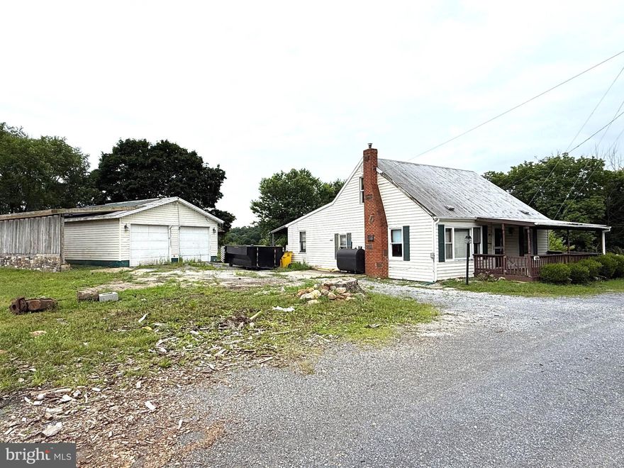 Two parcels totaling 1.14 unrestricted acres. Bring your vision to this 2BR/1BA cape cod because the square footage and layout may lend itself to convert to 3BR's and/or an additional bath. 24X30 detached garage.  22x25 block building/shed. Sump pump has been added to the basement and electric has been upgraded! Nice location along Rt. 51. The additional parcel of land with the stone fireplace fronts the road. The lot is deep and runs beyond the fenced area in the back yard. Lots of potential with this property!