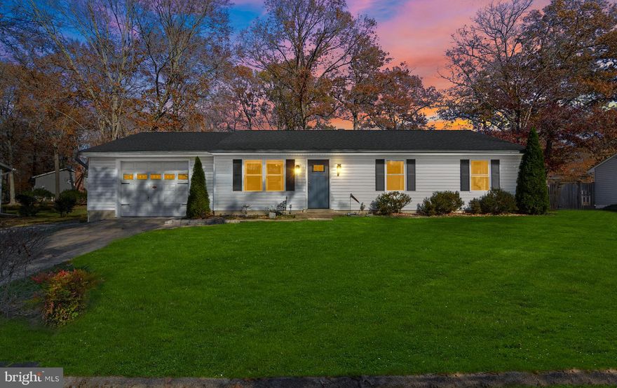 Welcome home to this beautifully updated, like-new rancher in highly desirable Davidsonville! This turnkey 3-bedroom home has been thoughtfully renovated throughout, offering modern upgrades and effortless one-level living. Step into a bright, spacious living area with hardwood floors flowing through the entire home. To the right are three comfortable bedrooms—including a primary with a half bath—and an updated full hall bath. The dining area opens to the stunning fully remodeled kitchen, featuring quartz countertops, gorgeous tilework, Samsung stainless steel appliances, and ample cabinetry. The adjoining laundry room provides additional pantry space and includes a new washer and dryer. Outside, enjoy a large, well-maintained backyard complete with a new deck and shed. The home also offers excellent curb appeal with a 2-car paved driveway and an oversized 1-car garage. Major updates include: new roof, windows, doors, HVAC, water system, reverse osmosis system, updated bathrooms, fully renovated kitchen, new deck, and new laundry appliances. All big-ticket items have already been taken care of. With top-rated schools and easy access to Annapolis, D.C., and Baltimore, this beautifully updated home is the perfect blend of comfort, convenience, and quality. Don’t miss it!