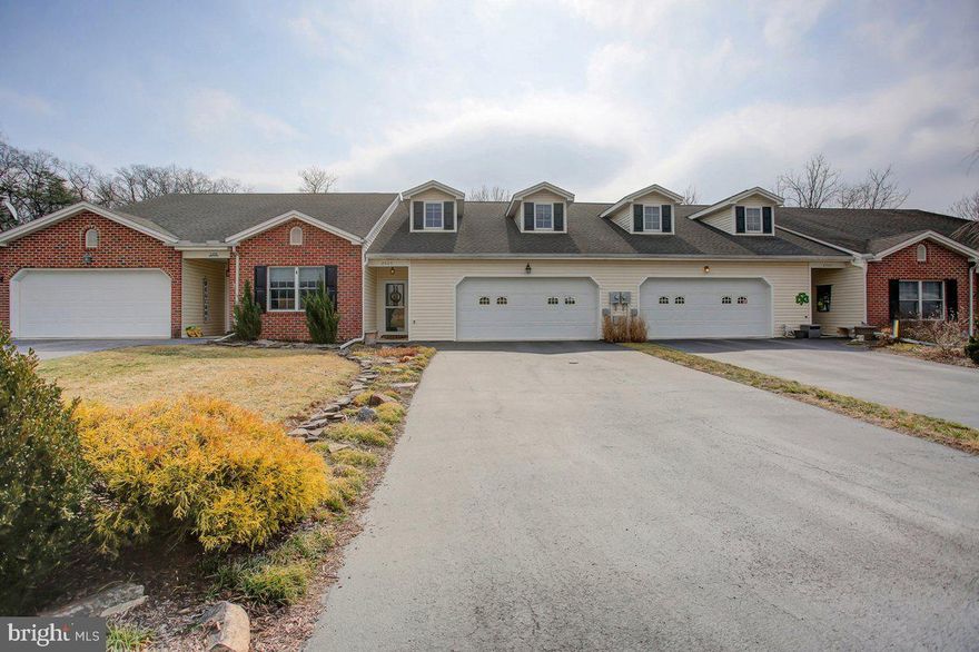 Step inside and experience the immaculate care and thoughtful updates in this move-in ready 2-bedroom, 2.5-bath home. Say goodbye to mowing the lawn and shoveling snow—this low-maintenance property lets you enjoy all the comforts of home without the hassle.

The spacious great room welcomes you with a soaring cathedral ceiling, skylight, and a cozy gas fireplace. The kitchen is a well-planned delight, featuring Corian countertops, stainless steel appliances, tile flooring, and convenient pull-out drawers in the cabinetry for easy access and organization.

The primary suite is located on the main floor and offers both a walk-in closet and a double closet. The primary bath includes double sinks and a linen closet for extra storage. Upstairs, the open loft offers a large sitting area—ideal for a home office, library, or relaxation space. The second bedroom includes a spacious dressing area and another walk-in closet. A small attic space adds to the storage options.

Step outside to the peaceful deck that overlooks a tranquil stream and wooded landscape. A footbridge at the back of the property connects you to a serene wooded area owned by the HOA—your own private escape in nature.