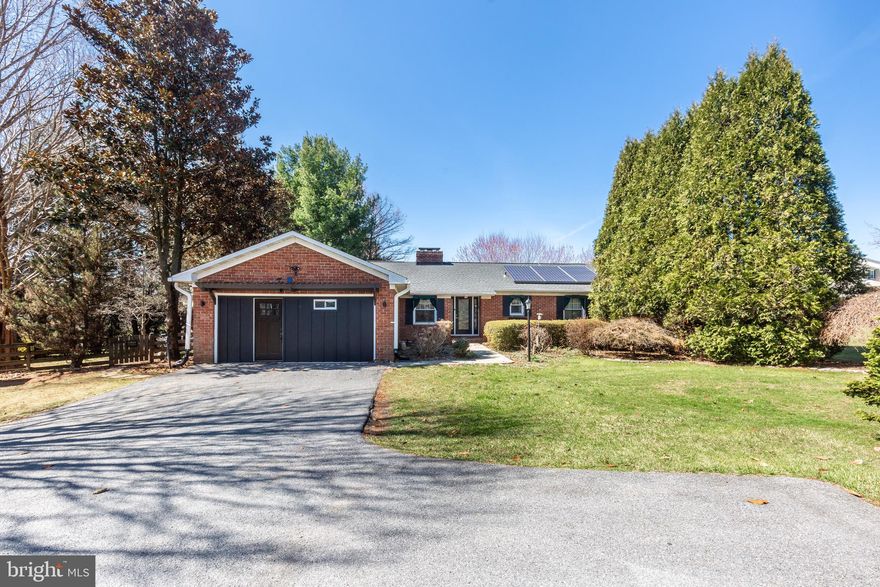 Discover your private sanctuary on nearly 2 acres, where sustainable living meets modern comfort. This one-of-a-kind 4-bedroom, 4-bathroom estate offers the perfect blend of tranquility, functionality, and thoughtful upgrades. Freshly painted and move-in ready, the home features major updates including a durable tile roof (6 years old), a 66-gallon hybrid heat pump water heater (3 years old), and energy-efficient systems throughout. Embrace eco-friendly living with solar panels, a windmill, greenhouse, and chicken coop—perfect for those seeking a self-sustaining lifestyle. Inside, natural light pours in through skylights and a stunning sunroom, creating a warm and inviting atmosphere. The spacious layout includes separate living and dining rooms, two cozy fireplaces, and a fully finished basement—ideal for entertaining or additional living space. A thoughtfully converted garage now serves as an expansive primary suite retreat, complete with a private bathroom and luxurious soaking tub. The property’s standout feature is a custom-built 23' x 28' detached garage, currently used as a peaceful yoga studio—offering endless possibilities for a home business, gym, or creative space. Step outside to unwind on the large deck overlooking a serene fishpond, surrounded by nature and privacy. With recessed lighting and ceiling fans throughout, every detail has been designed for comfort and ease. This is more than a home—it’s a lifestyle. Don’t miss your chance to own this exceptional retreat!  Schedule a Showing Today!