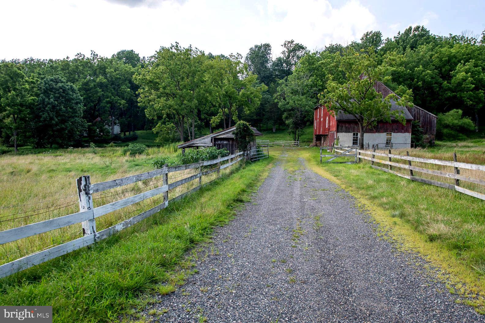 This could be the one you've been waiting for. Available for the 1st time in 65 years is this unique opportunity to own a piece of history. Situated on 14 (+) acres is a Circa 1860 Stone Farmhouse, Bank Barn, Pond, and open pastures in a serene country setting. The expansive lot size allows for a sense of privacy and open space, ideal for anyone seeking a peaceful, rural lifestyle. The 3BR House and Barn need upgrading and improvements, however once renovated, present the opportunity to enjoy the tranquility of being in a farm setting, yet moments away from shopping, dining, etc. Seize this rare opportunity before it vanishes. All dimensions of lot and building/room sizes are estimated and should be verified by consumer for accuracy. Property is being sold "AS-IS" and with all items remaining. Seller wishes to make no repairs. PLEASE DO NOT WALK THE GROUNDS WITHOUT HAVING AN APPOINTMENT WITH YOUR AGENT! Thank you