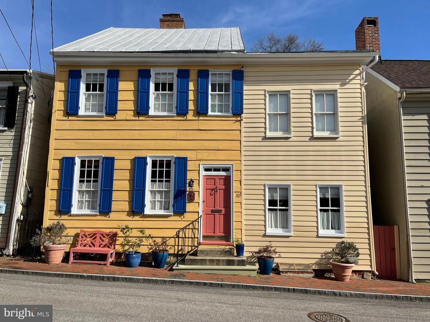 WELCOME to this charming Circa 1775 Historic District beauty in old town Annapolis (also known as the Samuel Hutton House), which has been renovated and wonderfully maintained.  It is very conveniently located just two blocks from the Naval Academy, and just one block from restaurants, shopping, and City Dock.  You will enjoy entertaining your family, friends, and guests, while cozying up to one of 3 fireplaces in the winter, or relaxing for a summer backyard barbecue in your tranquil outdoor garden with walled/fenced brick patio.  The screened-in porch with skylights is a perfect 3 season retreat from life’s hectic pace as well--not to mention the 2nd floor stargazing deck. This historic 4 bedroom, 3 bath home features original wood floors, alcove/loft just off the exposed brick kitchen, plus a top floor attic clubhouse hideaway with water and State House views—so many possibilities.  The bright, spacious, and oh so gracious living and dining rooms each have a fireplace, as does the owner’s bedroom, also boasting a walk-in closet and en suite bath and tub.  Two more bedrooms share a second bath upstairs and access to the upper deck.  Off the main downstairs living and dining area is a separate suite with bedroom/den, full bath, and space for office or other possibilities.  The basement offers lots of room for storage, tools, and garden access.  Step back in time with this phenomenal home and Live the Intriguing Historic/Modern Annapolis Water-Oriented Lifestyle—EVERYTHING YOU NEVER KNEW YOU ALWAYS WANTED, SEIZE THE OPPORTUNITY!!!