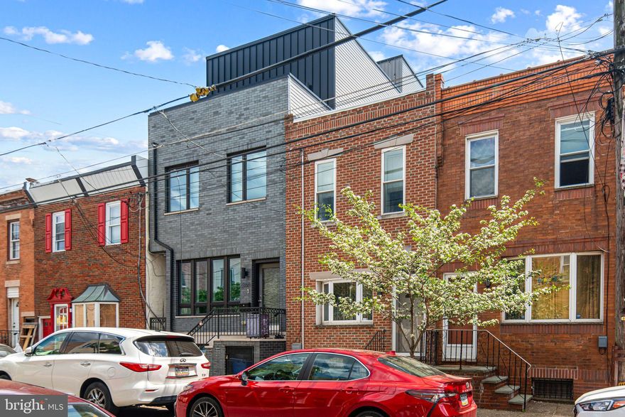 Meticulously maintained and upgraded home in desirable Port Richmond! Very large property 14 x 112 with a 14x14 two story addition built in the backyard, together totaling 2300 square feet of living space. Kitchen was recently upgraded (2024) with new flooring and light fixtures.

First floor features open concept Living Room that leads to your beautiful and functional updated Eat-in Kitchen with 42" cabinets, granite counters, breakfast bar with updated appliances.  Also on this floor is 1/2 Bath and convenient main floor Laundry! The Pièce De Rèsistance is an additional family room in the rear that can become whatever you can think up. Keep going out to your fenced in private yard where you can enjoy summer nights or let the dogs run. Your large addition out back was used as a private gym but can be your home office, studio, or whatever your heart desires!

Head upstairs to your large Primary Bedroom with a huge, custom  walk-in closet. Bathroom was recently fully updated (2025) with stand-up all tile shower with seat and glass shower door, touch mirror for anti-fog and color, a stunning stand-alone soaker tub, and bone laid tile flooring. Third bedroom in the back has also been updated and expanded. This house has everything you could need and want. 

Within walking distance to vibrant restaurants like Philly's famous Tacconelli's Pizza & Stocks Bakery, and easy access to public transportation & I95. Make your appointment today and live where you love!