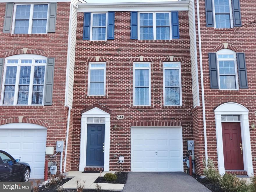 Brick front town home with bump outs on all levels!  Gourmet Kitchen and Master Super Bath. Vaulted ceilings top level, 9' ceilings mid-level. Entry level family room plus den with full bath. Mid level has living room, Gourmet Kitchen/dining room, Sun Room and a rear deck facing trees. Master bedroom has a sitting area and luxury bath w/jacuzzi.  You will think you are in a Model!! It's Beautiful!