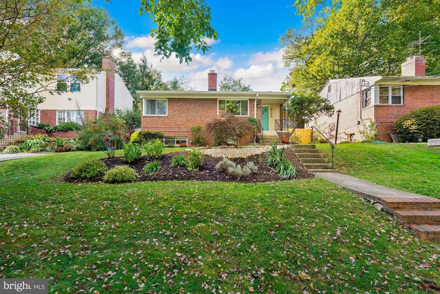 Welcome Home! Your home search stops here. This beautifully updated home in the sought-after BCC School Cluster is nestled on a quiet street in the Rosemary Hills neighborhood of Silver Spring. Nestled with meticulous landscaping around the home, this beauty exudes stunning curb appeal.  Amongst the countless renovations are a sun-filled open concept with an updated, gourmet kitchen (renovated within the last 5 years) featuring quartz counters & island, gas cooktop, and premium stainless steel appliances; spacious dining and living room spaces; wood-burning fireplace; freshly painted interior; new closet doors and gleaming hardwood throughout the main level; and three generously sized bedrooms on the main level with a renovated upstairs bath boasting marble tile floors, tub, sink, and fixtures. The lower level features a finished, walkout basement that leads to a serene oasis in the backyard with brick patio. This stunning home comes complete with a new roof, new water heater (replaced in Jan 2020); new furnace (installed in July 2020); solar panels (leased) and ample street parking. Conveniently located near downtown Silver Spring, within minutes to the Metro & DC line, shopping, dining and Rock Creek Park.