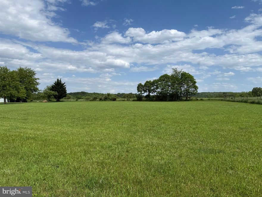 2.50 Open Acres with a beautiful setting. Camping trailers allowed but for only 6 months at a time.  The previous owner had plans to build so she poured slab (30x44), installed piping for radiant floor heat.   PLUS, the well is already drilled and electric hookup.  Septic permit for a 5-bedroom home. Sleepy Creek Orchard has a HOA and protective restrictions. Enjoy the access along Sleepy Creek at the end of the subdivision.