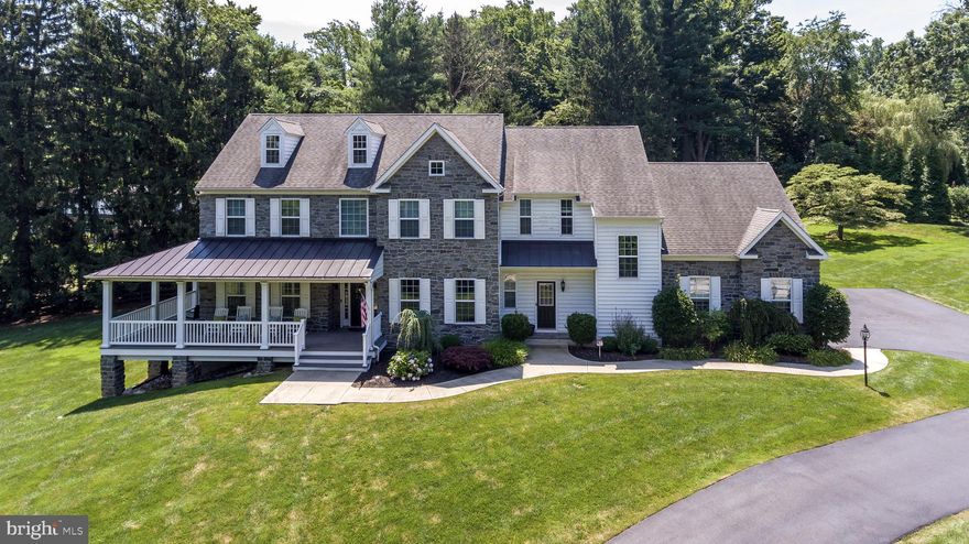 Character, Charm and Casual Elegance have combined to create this Spectacular 10 Year Old Custom Farmhouse-Style 5 Bedroom Colonial with 6475 sq ft including the Daylight Finished Basement, on a fenced 2.19 acre lot in Fort Washington, with exciting Open Floor Plan, Wide-Plank Hardwood Floors, 10'  first floor ceilings and fabulous appointments, located within walking distance to the town of Ambler with train station to center city. The covered, maintenance free, wrap-around front porch offers the first delightful  taste of this special home.  The inviting Entrance Foyer with wainscoting leads to the Picture-Perfect Dining Room, Family Room and Kitchen, all beautifully open to each other. The gorgeous Gourmet Kitchen features white 42" cabinets, granite counters, center island, tiled backsplash and stainless appliances including a GE Monogram 6 burner gas stove with pot-filler and center island with seating adjacent to a sun-filled Breakfast Area with walls of windows and French door opening to the exterior. The Kitchen is open to the stunning Family Room with gas, stone fireplace, surround sound, and coffered ceiling. A Butler s Pantry with granite counter, wine fridge and wine rack leads from the Kitchen to the gracious Dining Room with tray ceiling, double crown molding and surround sound. The super-sweet Living Room provides a French door opening to the side portion of the wrap-around porch. The Study includes custom shelving and cabinets, with a French door opening to the rear Hall. The 1st Floor also includes 2 separate, updated Powder Rooms and a fabulous Mud Room with built-in bench with storage and multiple closets. 2 sets of stairs with hardwood treads and carpet runners lead to the 2nd Floor. The extremely spacious Master Suite includes surround sound, a tray ceiling, Seating Area and 2 walk-in closets, and the gorgeous, upgraded Master Bath offers dual marble vanities, spa shower with pebble-tiled floor and frameless glass door and soaking tub. 4 additional Bedrooms with 2 Full Baths, include one en-suite, and a Laundry Room with tiled floor and cabinets completes the 2nd Floor. The Daylight Finished Basement offers endless opportunities for Fun, including a Media Room with surround sound, Exercise Room and Game/Play Room plus Powder Room and ample storage.  The covered rear Patio with wood ceiling and speakers is accessed from the Kitchen and overlooks the gorgeous grounds. Other fun facts: Plantation shutters thru-out; Security system, Central vac, Irrigation system, new whole-house Generator and NO STUCCO! Located within excellent Colonial School District and 5 Minutes to Germantown Academy, plus minutes to 2 train stations providing easy access to center city and minutes to the PA turnpike. Also close to Ft. Washington State Park. 1 Year Home Warranty included. This is the one you have been waiting for!