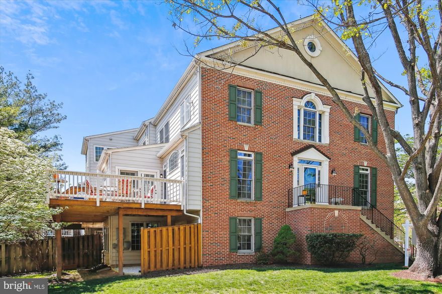Rare-to-market 4BR/3.5BA luxury brick end unit townhouse built by Winchester Homes in Rose Hill Falls.  Approximately 2,450 square feet of living area on three levels plus a two-car garage.  Special features include 9-foot, cathedral, and vaulted ceilings; two gas fireplaces; upstairs laundry; maple hardwood flooring and 18” x 36” ceramic tile throughout the main level; newer designer carpeting on upper and lower levels; remodeled kitchen with new white shaker cabinets, quartz countertops, ceramic tile backsplash, and upgraded appliances; new Travertine tile flooring, quartz vanities and bath fixtures in updated upper level baths; custom painting, upgraded lighting, detailed molding package, and custom window treatments throughout; outdoor space highlighted by a wrap-around deck overlooking an oversized end unit yard.  Brick front and side elevation with side entrance; front door with sidelites and upper transom windows opens to foyer with new chandelier; center hallway with recessed lighting, coat closet, and powder room with pedestal sink; formal living room and dining room combo with floor-to-ceiling windows with semi-round transoms above, crown molding, and new chandelier; butler panty with dry bar, glass cabinetry, and quartz countertops; open kitchen floorplan with new 42-inch shaker cabinets, quartz countertops, ceramic tile backsplash, upgraded appliances, center island/breakfast bar with gas downdraft cooktop, pendant lighting, recessed lighting, and walk-in pantry; family room off kitchen with double-windowed exposure, gas fireplace with slate hearth, and ceiling fan; glorious sunroom/breakfast room with floor-to-ceiling windows, new chandelier, and double French door to rear deck; solid oak staircase with carpet runner to upper level; spacious primary bedroom suite with cathedral ceiling, ceiling fan, and walk-in closet; renovated primary bathroom with vaulted ceiling, 12” x 24” Travertine tile flooring, double 36-inch quartz vanity, and walk-in shower with frameless glass enclosure and designer ceramic tile surround; two additional bedrooms with vaulted ceilings and double-door closets; remodeled hall bath with 12” x 24” Travertine tile flooring, quartz vanity, and tub with designer tile surround and frameless glass doors; upper hallway landing with linen closet and laundry center with washer and dryer; lower-level recreation room with recessed lighting, corner gas fireplace with slate hearth and wood mantel, ceiling fan, storage closet and French doors to rear yard; 4th bedroom or exercise room with adjacent full ceramic tile bath; lower foyer access to two-car garage.  Brand new architectural shingle roof in 2025, upgraded HVAC with humidifier, and 50-gallon gas water heater.  Without leaving the neighborhood, there are over a mile of bucolic walking/bike paths, forested conservation areas, sidewalks, two tot lots, a private tennis court, and a basketball court.  Adjacent to the development sits the City of Rockville's Bullard Park at one end of the neighborhood and Julius West Middle School's sports fields, track, and tennis courts on the other side.  Be part of the vibrant Rockville Town Center featuring shopping, fine restaurants, sidewalk cafes, the Rockville Regional Library, Regal Cinemas, and other entertainment and cultural facilities.  Less than a mile from the Rockville Metro (Red Line) for those looking to commute via mass transit.