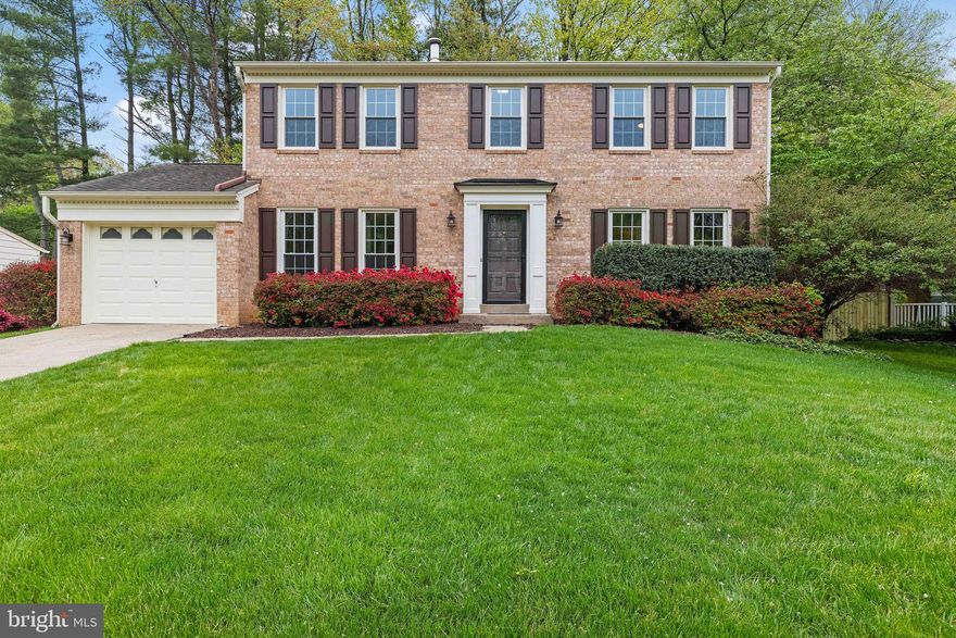 Welcome to 8621 Etta Drive. Nestled in the heart of West Springfield, this beautifully maintained and thoughtfully renovated brick-front colonial offers over 3,600 square feet of elegant living space. From the moment you step into the grand foyer, you’ll be captivated by the sweeping curved staircase and timeless architectural details throughout.

The main level boasts a classic and functional layout, including a formal living room, dining room, powder room, and a mud/laundry room. The spacious family room, complete with a cozy wood-burning fireplace and custom built-in cabinetry, flows seamlessly into the large eat-in kitchen featuring rich wood cabinetry, gleaming granite countertops, stainless steel appliances, and ample space for casual dining. Crown molding enhances the main and upper levels, while refinished hardwood floors grace the kitchen and family room. Plush new carpeting adds warmth to the formal living and dining rooms.

Step outside to your own private oasis—perfect for relaxing or entertaining—featuring a low-maintenance Trex deck and a fully fenced backyard offering privacy and serenity.

Upstairs, the luxurious primary suite is a true retreat with newly installed hardwood floors, two walk-in closets, and a versatile sitting room or library with an additional closet. The updated primary bathroom includes an oversized walk-in shower and a spacious vanity. Three generously sized bedrooms and a stylishly renovated hall bath complete the upper level.

The finished lower level offers a flexible space ideal for hosting or unwinding, featuring a large recreation room with a wet bar, a full bathroom, and a spacious storage/utility room.

Additional highlights include a one-car garage, updated windows with blinds, a new water heater (2021), and an AC system (2018).

This home is perfectly situated for commuters, with easy access to I-95, I-395, I-495, the Fairfax County Parkway, Franconia-Springfield Metro, VRE, and express bus service to the Pentagon via the nearby park-and-ride lot. Zoned for the highly sought-after Hunt Valley Elementary, Irving Middle, and West Springfield High School—with Hunt Valley just a short walk away.

Enjoy the best of Northern Virginia with nearby outdoor destinations like Burke Lake Park, Lake Accotink, South Run Rec Center, Hidden Pond trails, and Pohick Regional Library. Grocery stores including Lidl, Trader Joe’s, Whole Foods, Safeway, and Giant, as well as a variety of dining options, are just minutes away. Optional memberships are available at Hunt Valley Pool, Orange Hunt Pool, and Rolling Valley Pool.

This is more than just a house—it’s a place to call home. Don’t miss your chance to experience all that 8621 Etta Drive has to offer. Schedule your private tour today!