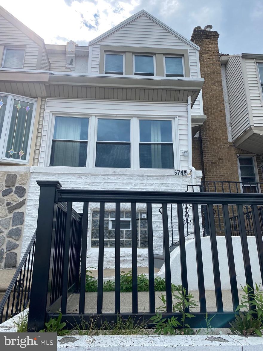 Two-story rowhome needing only TLC. The property had a major renovation in 2018 including new electricity,  new plumbing, a new roof, new windows, and a new heating system. This home has a closed porch, a large kitchen, a living area, three bedrooms, one bathroom along with a full basement, and an attached garage with a rear entrance, making this property a worthwhile project to gain instant equity. The home is located across the street from Fern Rock transportation center, shops, restaurants, and all major roadways. House is been sold in AS-IS condition. The seller will not make any repairs.