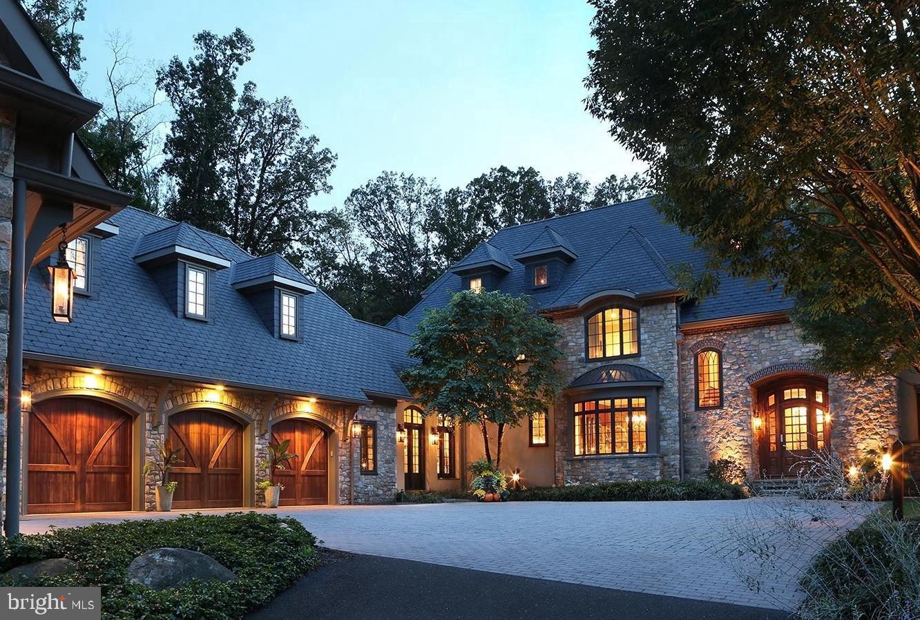 A home of singular distinction in the historic heart of Gwynedd Valley created in 2009, privately sited along the banks of the Trewellyn Creek. A European influenced design by renowned architect Rene Hoffman featuring fieldstone and contemporary standards of large windows, open floor plan and character design details. The interior millwork designed and built by Jonathan Trueblood represents the absolute pinnacle in artisanal architectural finishes. The creek and wooded views afford privacy unequalled in the immediate area. The property consists of a discreet 5.77 acre site accessed down a long driveway and over a wooden bridge. The house of 12,278 + square feet includes 6 bedrooms, 7/1 bathrooms, a dynamic master suite with his and her dressing rooms and private bathrooms. Generous in layout, the interior spaces are intimate. While traditional in style with contemporary touches, the overall house conveys casual elegance. The central family great room invites all to congregate in stone-walled and hand-hewn beamed warmth. Personal retreats and common areas offer the peace and the comfort of a well-loved home. A magnificent mahogany library provides a commanding view of the Trewellyn Creek valley. A personal, home theater follows the reclaimed grist mill-themed architecture, provides an intimate screening experience with a sophisticated lighting program to enjoy your favorite shows on top technical equipment. The Creek Room features a bespoke fireplace with a free-edge surround of oak flitches 30" wide balancing a radius of bay windows right above the creek's edge. A complete gym and related sauna make for a well-appointed lower level. Outbuildings include a garage with oversized parking for three automobiles, workspace and an independent apartment above. A garden house with more vehicle spaces and storage complete a welcoming entrance courtyard. Specifications and complete details are available upon request. We welcome you to plan a visit to tour the property in person.