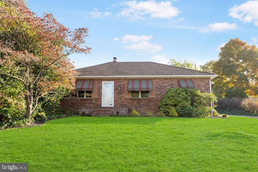 Very well kept brick ranch on 8/10 acre lot just outside Red Lion.  Large concrete patio in rear yard.  Yard extends deep behind garage.  Home nicely painted and has beautiful hardwood floors in LR, DR and two bedrooms.  Living room and dining room are very spacious.  Lots of kitchen cabinets.  Stairs to attic for storage.  Full basement has family room with brick fireplace and large laundry room with full bath.  Outside exit to rear yard.  Home has replacement windows.  Move in condition.  Home is being sold to settle estate.  Sold As-Is seller will do no repairs.