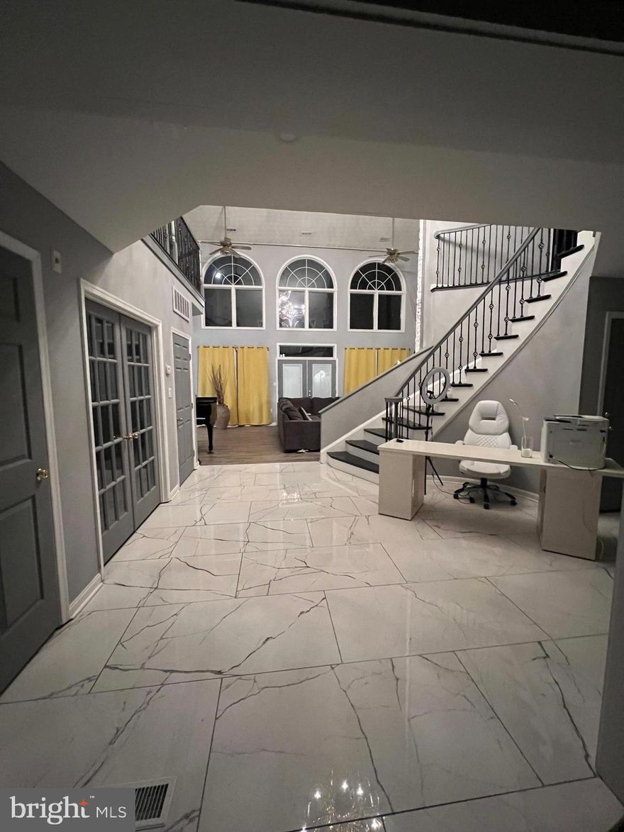 OVER 8,400 sq. ft. of living space.  This stunning 7-bedroom, 4.5-bathroom estate is truly a masterpiece, perfect for those seeking luxury, privacy, and endless comfort. Situated on a hill, this home welcomes you with a grand double-door entrance, a two-story family room, and a striking marble foyer complete with a circular staircase.

The master suite is a private retreat, featuring a walk-in closet, a luxurious master bath with a separate soaking tub, and a double shower designed with dual shower heads—perfect for royalty. Convenience meets elegance with the upper-level laundry room accessible directly from the master.

The spacious gourmet kitchen is a chef's dream, boasting a 10-foot island, custom cabinetry, and double doors that lead to a composite deck with built-in seating—perfect for outdoor entertaining. For added comfort and style, the home offers an enclosed private family room, a formal dining area, and luxury vinyl plank floors throughout.

Additional highlights include a fully finished detached studio-size treehouse, a large in-ground swimming pool, a basketball court, and a private park with room for picnic tables. The long circular driveway provides ample parking, along with a 3-car garage, all topped off with a newly installed roof under 4 years old.

With 12 rooms in total, including two home offices and a piano room, this all-brick home offers space, elegance, and functionality at every turn. Don't miss the opportunity to experience this breathtaking property—a perfect fit for a Queen, King, or anyone looking to live in unparalleled luxury.