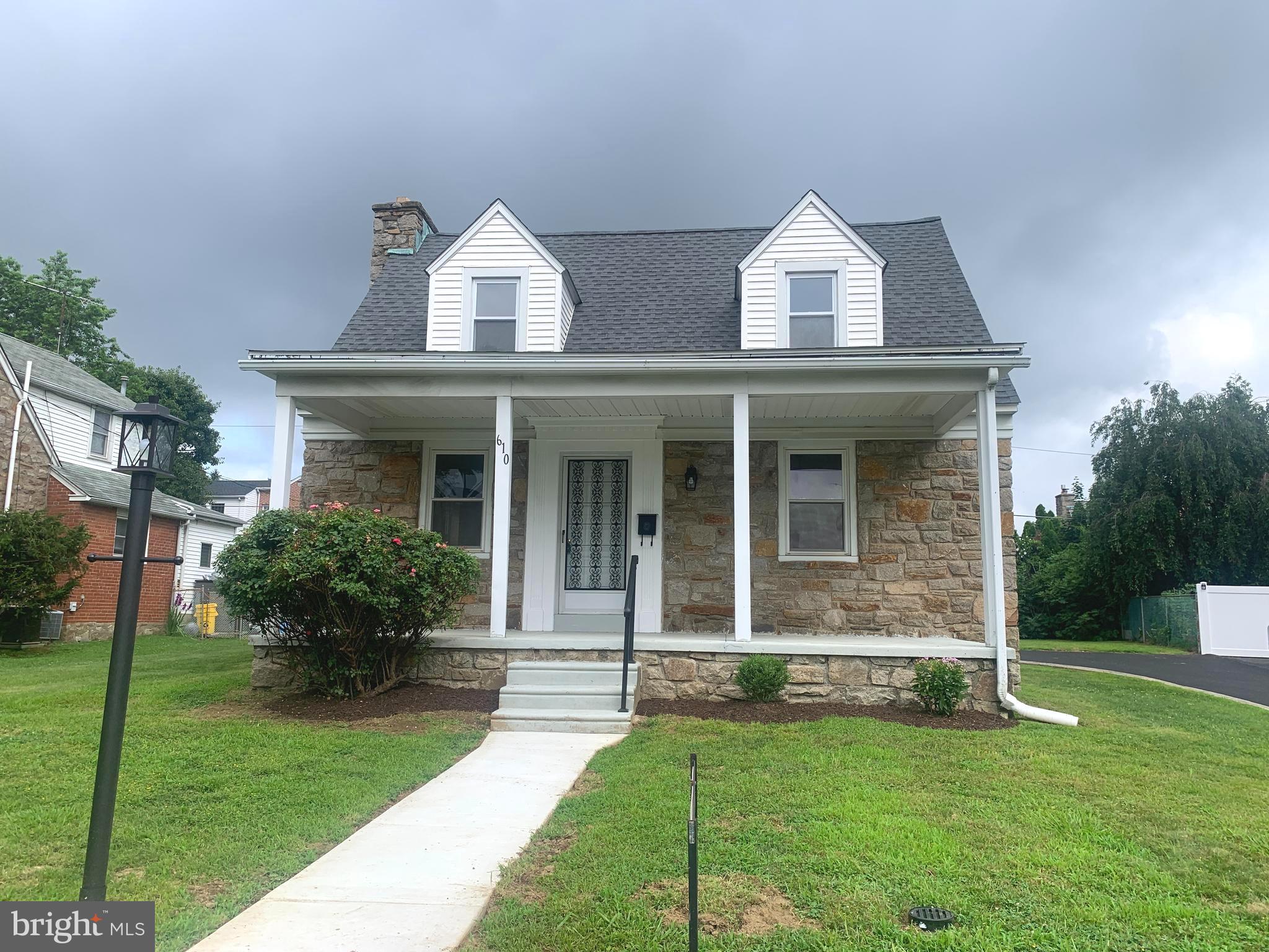 Well Kept , expanded and updated Mozino built Stone & Brick home with 3 Bedrooms, 2.5 Baths and easy conversion for a main level Bedroom with its own bath (already in place). Covered Front Porch, extra large Covered Rear Patio. Full width New driveway (2025) too. MAIN LEVEL: Large Living Room with fireplace, hardwood flooring, Dining Room with hardwood floors, Updated Kitchen with island and breakfast bar, Family Room with new carpeting, bow window, updated Full Bath with shower & vanity, door to Rear covered Patio. UPPER LEVEL offers 3 nice size Bedrooms, and updated Hall Bath with tub/shower combo. BASMENT is finished with ceramic tile flooring, recessed lighting, combo Laundry/ Powder Room, 2 cedar closets, built ins with sink and waterproofing system. New Heater & Central Air (2024) , 200 amp Circuit Panel, New Roof (2024). This home is ready for you to move right in !