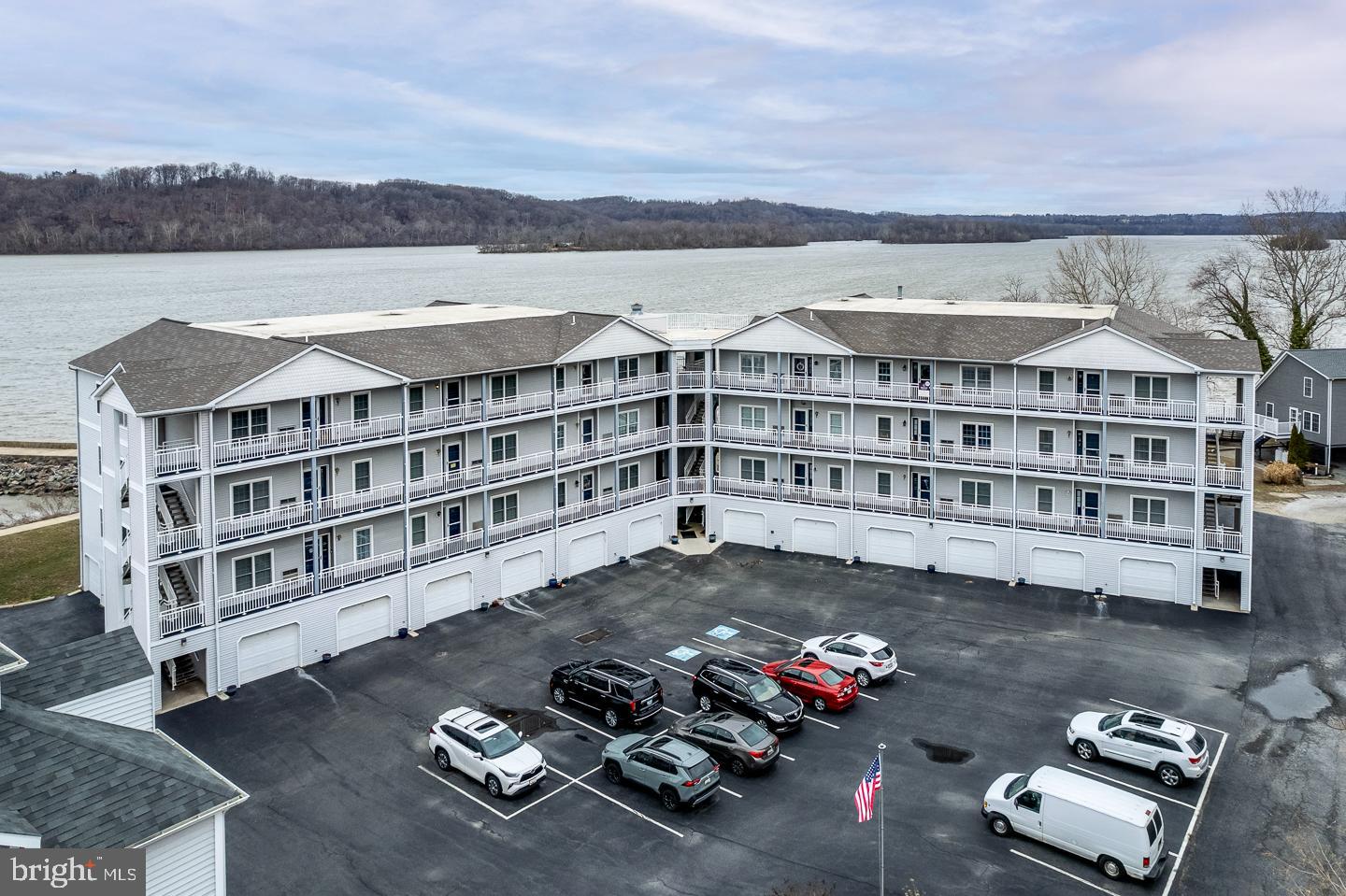 REDUCED FOR A QUICK SALE! SELLER OFFERS BUYER A $3900.00 CREDIT TOWARD CLOSING COSTS WITH AN ACCPTABLE OFFER. THIS PLACE IS AN ABSOLUTE DEAL!
Stunning Waterfront Penthouse Condominium in Historic Port Deposit
Take time to see this gorgeous third-floor penthouse condo, offering unparalleled waterfront views of the Susquehanna River, situated in the heart of historic Port Deposit. This spacious 2-bedroom, 2-bathroom home boasts an open floor plan that seamlessly blends modern living with breathtaking natural beauty.
Upon entering, you'll be greeted by a beautiful galley kitchen featuring sleek stainless-steel appliances, a stylish brick backsplash, crisp white cabinetry, two spacious pantries, and a separate laundry room for added convenience. The home is adorned with lovely Cali bamboo flooring throughout the main living areas and luxurious Stainmaster carpeting in the bedrooms, adding both elegance and comfort.
The expansive primary bedroom is a true retreat, with stunning water views and access to the luxurious ensuite bathroom, which includes H/H sinks, a sunken soaking tub, a separate shower, and a large walk-in closet. The second bedroom is generously sized and has direct access to a full bathroom, which can also be conveniently accessed from the hall as well. Perfect for guests!
Off the kitchen, you'll find an eat-in dining area opening to the family room and a gorgeous sunroom. The centerpiece of this home! This sunroom is a year-round haven to soak in the picturesque water views, featuring a sitting area and a dedicated office space with floating shelves, ideal for remote work or creative pursuits.
Step outside onto the private balcony (28’ x 8’) and experience stunning sunset views – perfect for outdoor entertaining or quiet reflection. The home is also equipped with six ceiling fans and fresh custom paint throughout, offering a move-in ready experience.
For additional storage, this condo includes an oversized (30’ x 13’) one-car garage, providing ample space for parking as well as room for a golf cart or other recreational vehicles.
Tomes Landing II community amenities include an elevator, plenty of overflow parking, and optional access to a pool membership and clubhouse. Boaters will appreciate the nearby marina with slip rentals and high-and-dry storage. For those who enjoy outdoor walks, the riverfront promenade leads to Lee’s Landing, and just a block away, you'll find an array of restaurants, bars, and boutiques. This prime location offers easy access to Hollywood Casino, Great Wolf Lodge, and major commuting routes including I-95, Route 1, Route 40, and the Marc Train.
Don't miss the opportunity to call this exceptional penthouse condo your new home – where modern comforts meet spectacular riverfront living.