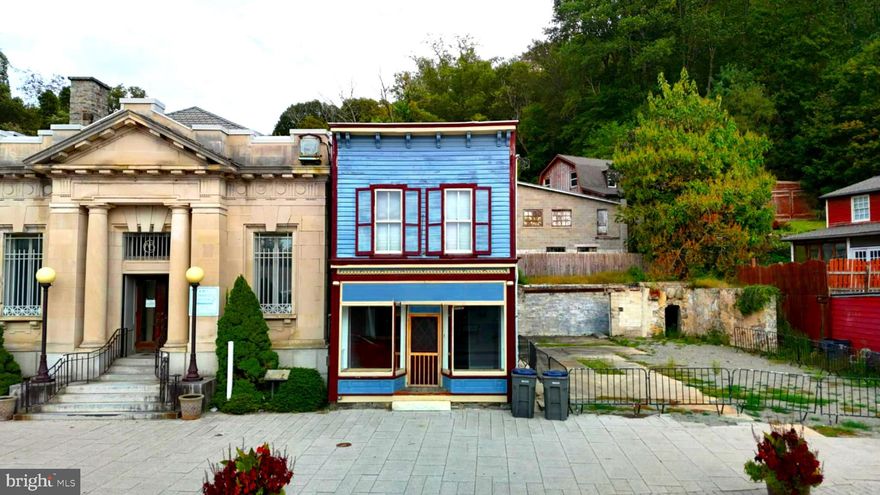 Welcome to 8 S Main Street in the heart of historic Port Deposit — a rare opportunity to secure a 750-square-foot commercial storefront with unbeatable visibility. Located directly across from the Post Office and Lee’s Landing at a busy three-way intersection, this property sits in one of the highest-traffic areas in town. Every car that comes through Main Street stops right here, giving your business constant attention and exposure.

The space itself features large front windows that look out onto Main Street, perfect for showcasing products, signage, or creating an inviting storefront. With an open layout, this property offers endless possibilities — whether you’re envisioning a boutique, coffee or ice cream shop, professional office, or even a small gallery space. The building is currently a shell, allowing you to make it entirely your own, and the low monthly rent makes it an ideal option for entrepreneurs or small business owners looking to start or expand their business without heavy overhead costs. The tenant is responsible for build-out and utilities.

Please note, this property is zoned commercial only and cannot be used for residential purposes.

Surrounding this property, you’ll find a variety of popular restaurants and shops, adding to the energy and steady foot traffic that makes this downtown location so desirable. Port Deposit itself is a true Eastern Shore treasure — a scenic, historic riverfront town with a large waterfront park, playground, pavilion, boat ramp, and marina that attract visitors throughout the year.

Convenience is another major plus — the property is just three miles from Interstate 95, five miles from Route 1, twenty miles from the University of Delaware, and only forty-five minutes from Baltimore. Whether you’re serving locals, travelers, or weekend visitors, this location puts you in the perfect position to succeed. This is for the bottom store front of the building only the apartment upstairs is already rented.

If you’ve been searching for a prime, affordable location to launch or grow your business, 8 S Main Street in Port Deposit offers visibility, flexibility, and small-town charm with big opportunity.