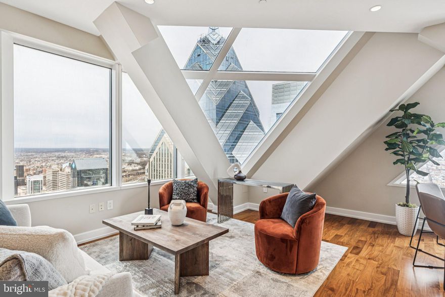 THE VIEW BELONGS TO YOU! - Enjoy sweeping panoramic skyline views from this magnificent two bedroom plus den, two and a half bath residence in the sky. Soaring 53 stories above the city, this coveted home is a one-of-a- kind architectural masterpiece boasting walls of windows and some of the most incredible skyline, sunset and river views that you won't find anywhere else. The living and dining areas feature dramatic ceiling heights, gleaming hardwood floors, and walls of architectural windows which flood your space with an abundance of light. The chef's kitchen showcases marble countertops, SNAIDERO cabinetry, and SUB-ZERO and MIELE appliances. The main bedroom suite offers generous closet space and a lavish marble bathroom with double floating sink vanities, an oversized soaking tub and a large glass enclosed shower. The second bedroom is generously proportioned and features ample closet space and an ensuite bathroom. The den area offers additional space and can be used as a media room, gym or office. Designer finishes and an on-site storage unit complete this deluxe residence at Two Liberty Place. Association fees include a 24-hour concierge, chauffeur-driven car service, and access to a premier amenities floor featuring a state-of-the-art fitness center, an endless pool, a yoga studio, steam showers, and saunas. Perfectly situated in the center of it all, this residence is steps away from fine dining, one-of-a kind shopping, world-renowned cultural destinations, and exciting nightlife.