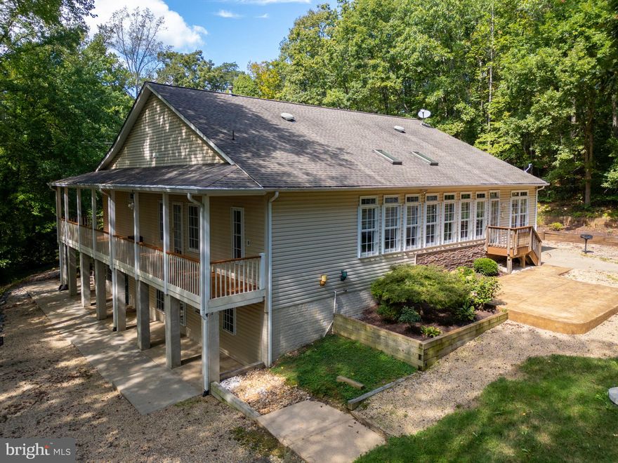 A home built with heart, designed to be loved! From the moment this custom rambler was a blank slate of land, to the first blueprint onto the final little touches, the original owner lovingly oversaw every detail of its creation ensuring that it was crafted with care, attention and pride. 

As you step onto the marine decking wraparound porch, you’re greeted by the charm of nature without the constraints of an HOA. Inside, the warmth of the home unfolds with over 4,480 finished square feet designed for both everyday living and special moments. 

The main level flows easily from room to room, filled with natural light and thoughtful touches. The kitchen, updated with beautiful quartz countertops, a reverse osmosis system, and generous pantry space has been the heart of many meals and memories. Just beyond, the sunroom invites you to slow down and take in the view, sharing a double-sided fireplace with the cozy den. It’s the perfect place to gather, laugh, and linger a little longer.

The primary suite is a true sanctuary, offering space to rest and recharge with a spa-like bath that even features a BioBidet toilet for added comfort and convenience. The main level also includes a separate office, perfect for those who work from home or simply need a quiet corner to think.
Downstairs, the fully finished lower level offers more than 2,200 square feet of flexible living space. With its own private entrance, full kitchen, bedroom, bath, laundry, cedar-lined closet, and abundant storage, it’s ideal for guests, extended family, or an in-law suite—multi-generational living at its finest.

This home was built to stand the test of time, and it shows. From the whole-house Generac Guardian 20kW generator and artesian well to the Fresh Aire UV water purifier, Nu-Tone sound system, epoxy garage floor, and marine decking on the wraparound porch, every detail was selected for comfort and longevity. Outdoor spaces are equally impressive with an inviting stamped concrete patio, a separate shed, and serene landscaping that feels private yet connected.

Located just two miles from Stafford Hospital and minutes from I-95, shopping, and dining, this home offers the best of both worlds—quiet country living with city convenience.

At the end of the day, 2286 Richmond Highway is destined to make you feel comfortable and warm, as well as your sanctuary for years to come. Come by and see how this home has been loved, maintained, and thoughtfully improved through the years and imagine where your next chapter begins within its walls.

Recent updates bring even more peace of mind: a new firebox for the dual-room fireplace (2025), freshly paved driveway and landscaping (2025), septic pump replacement (2024), quartz countertops (approx. 2022), updated tile in the guest bath (approx. 2022), and newer main-level windows with a transferable warranty (approx. 2017).