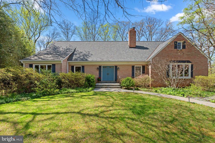 Charming Cape Cod in Bethesda's Deerfield.  Easy to show! This elegant custom Cape Cod sits at the end of a quiet cul-de-sac in one of Bethesda’s most desirable neighborhoods. Overlooking the scenic Cabin John Trail, the property offers a rare combination of privacy, natural beauty, and thoughtful design. Surrounded by azalea-filled gardens in the front and peaceful wooded views in the back, the home invites outdoor living—from morning coffee on the screened porch to gatherings on the deck, all accompanied by birdsong and the rustle of leaves. Smart and beautiful renovations in 2018, the home blends classic charm with modern updates. With approximately 4,600 square feet (per floor plan), it provides surprisingly generous space in a serene, storybook setting.

A Home Worthy of its Setting
The main level welcomes you with a gracious foyer. Straight ahead, a large picture window in the formal living room showcases an endless private wooded view. Designed for both comfort and function, the main level includes a formal dining room with French doors opening onto an expansive treehouse-level deck. Mirrored pocket doors seamlessly connect the dining room to a renovated kitchen featuring custom cabinetry, a soapstone island, Carrera marble countertops, a picture window over the farmhouse sink, and French doors leading out to the screened porch. The porch, finished with reclaimed weathered oak barnwood siding – intentionally selected in homage to the street name – provides a peaceful retreat among the trees and flows into the deck. On the opposite side of the kitchen, a side door steps out to a charming herb garden.  A cozy family room with wide plank oak floors features wooden beams, a wall of built-in bookshelves, and a fireplace set at a diagonal with a brick hearth. 

A main-level primary suite offers convenience and privacy at the other end of the home, away from living spaces, while a powder room and coat closet complete this level.

A curved staircase takes you from the foyer to the upper level. This floor features three generously sized bedrooms, two full baths, and thoughtfully enhanced spaces. The ensuite bedroom includes a well-sized closet and its own bath, while the two additional bedrooms share a spacious bath. A large cedar closet provides convenient storage. A standout feature is the 12.5' x 5' library nook—a smart design by the owner—that elevates the hallway into an inviting gallery with recessed lighting and built-in shelves, perfect for displaying books, art, or collections.

Northern exposure brings sunlight into a versatile room at the end of the hallway. This space, which was originally an attic that the owners transformed into a finished living space, has endless possibilities as a light-filled studio, game room, office, or even an upstairs primary suite.

The lower level adds even more space and functionality to the home. A downstairs guest room, complete with an ensuite full bath, offers privacy and direct access to its own deck with a retractable awning matching those that span the main deck, and overlooking a Zen forest garden.  A spacious recreation room opens onto the patio and backyard. Underneath the stairs to the main deck is a custom-built chicken coop, installed in 2020.

This level also includes a laundry room with built-in shelving, and a second walk-in cedar closet that can readily be converted to a sauna or half-bath. The owner cleverly set off extra space in the two-car garage with a sliding door, creating an unfinished workshop/studio. Don't miss the spacious storage room with a third cedar closet and shelving units that convey.

Situated just outside the Beltway, Deerfield is conveniently located to multiple shopping and recreation centers, and enjoys access by foot through the neighborhood to two elementary schools. Spacious living areas, thoughtful details, and a pristine connection to nature, all just 30 minutes to downtown DC,