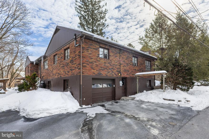 Discover the perfect blend of character and comfort at 612 Holly Court, ideally located in the heart of State College Borough. This mid-century modern inspired raised ranch home welcomes you with hardwood floors and an open-concept kitchen and family room anchored by a wood fireplace. The private primary suite features vaulted ceilings, abundant natural light, multiple closets, and a tiled shower, while an office with French doors completes this wing. Two additional bedrooms and a full bath round out the main level. The ground level offers flexible living space behind a sliding barn door, along with an unfinished workshop area and an oversized one-car garage, plus ample off-street parking - an added bonus for this location. Outdoor living shines with a deck, gazebo, fire pit, and outdoor kitchen complete with an Argentine grill and bluestone countertops. Enjoy the peaceful setting near East Fairmount Park, all while being just minutes from campus and downtown.