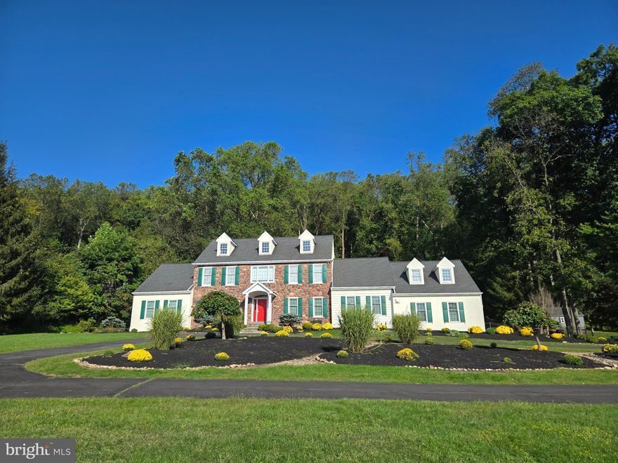 Distinguished custom built 4400sf house offers a beautiful setting, a great location, and
a home characterized by luxury design and special architectural features. Luxury size
rooms, a first floor primary bedroom suite, gorgeous exterior all in a private setting that
provides an exceptional and sophisticated lifestyle. The house has many features that
create its character and appeal. Gorgeous, detailed millwork, hardwood flooring, two
propane fireplaces,  new first floor front  windows, security system
and, yes, those famous Toto toilets are there. An impressive front entrance takes you
inside to a welcoming foyer with an office/study on one side and a formal living room on
the other. The gracious dining room has a fireplace and two corner built in cabinets. The
center of this home is the grand family room with vaulted ceiling, a soaring stone
surround for the raised hearth fireplace, and two atrium style doors with  arched windows above  to outside. The spacious eat-in
kitchen is a chef’s delight with custom cherry cabinetry, Sub-Zero refrigerator, Dacor
double wall ovens, Viking 6-burner cooktop and two dishwashers. A patio door in the
large casual dining area opens to the Trex deck and pool area. The first floor primary
bedroom has 10’ ceilings,  two walk-in closets and a door to its own
deck. The ensuite bathroom includes a soaking tub and walk in shower. Completing the first
floor is a laundry room and powder room. Upstairs is another primary size bedroom with
an ensuite bathroom and access to a very large storage room or additional walk in closet.  Two other bedrooms share a bathroom between them. A
delightful bonus is a large, finished flex space with a staircase to the kitchen. The attic with pull down stairs   it totally floored and has 3 dormer windows for future expansion.
There’s more. The finished basement has a sauna, powder room, recreation and hobby space,
a storage room with shelving, water softener, central vacuum connection, 80 gal. hot
water heater, a sump pump and a heat pump with oil backup. The more than 2 acres is
an idyllic setting for relaxing, eating, drinking, playing, and entertaining in style. The
heated swimming pool w/waterfall and spa, a fenced backyard with three gates, a partially
wooded area, newly built cabana waiting for your finishing touches, and a new storage
shed. This home is the perfect setting for entertaining inside and outside, whether small
groups or large events. Come see the landscaping, the impressive bluestone front
entrance, the 3-car garage and a circular driveway where parking is never a problem.
Everything is there. The location is convenient to the shopping, dining, museums,
entertainment and recreation places, in Doylestown, New Hope, and Newtown. Bring
your vision and style and enjoy nature’s beauty and tranquility in this exceptional home
that will always welcome you home.