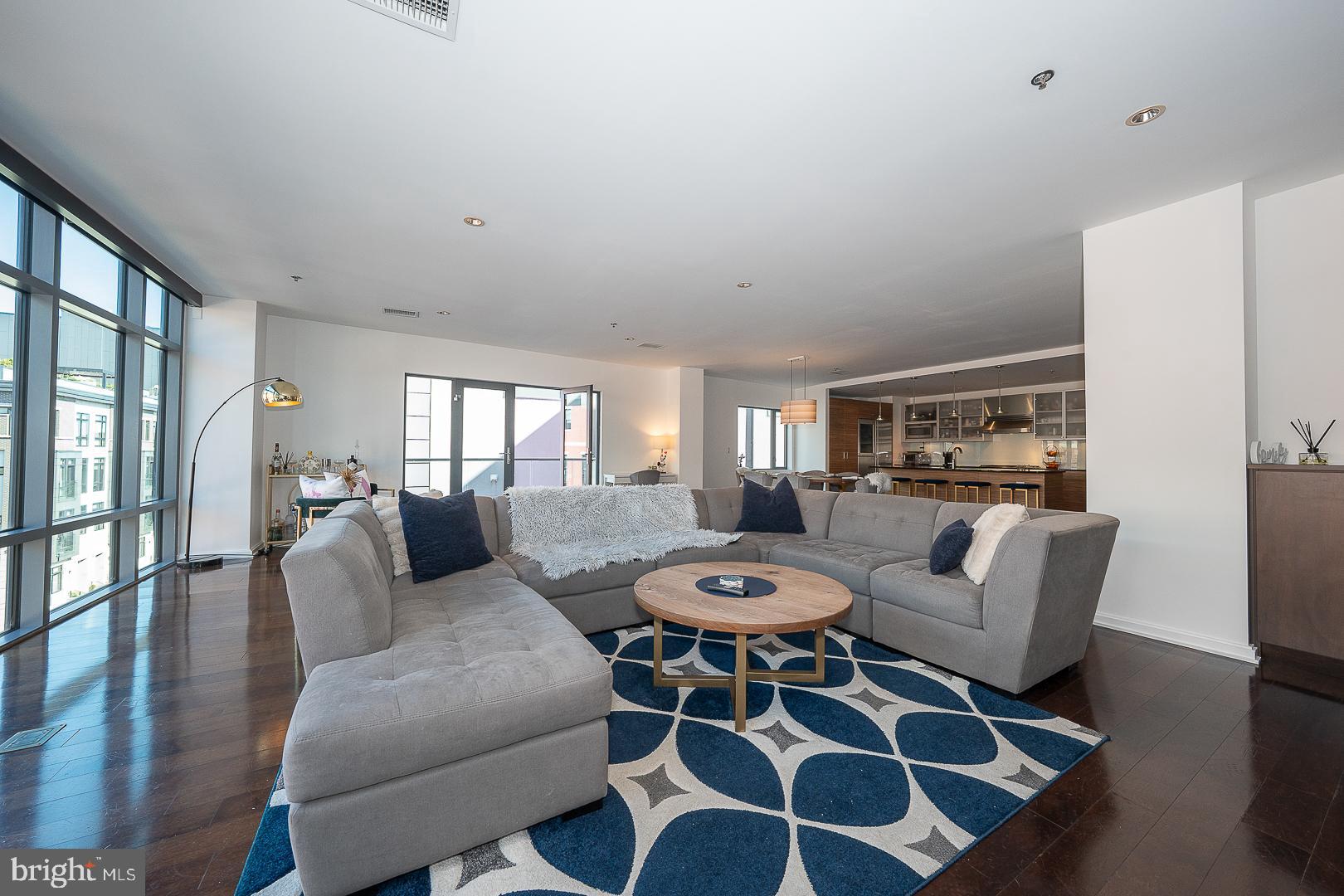 Welcome to this sophisticated 3-bedroom, 3-bathroom residence offering 2,386 sq ft of modern living in the heart of Old City. The open floor plan showcases hardwood floors, soaring floor-to-ceiling windows, and a private balcony that fills the space with natural light. The gourmet kitchen is an entertainer’s dream, featuring an oversized island, Wolf stainless steel appliances, and marble countertops, all overlooking the expansive living and dining areas. The luxurious primary suite boasts a spacious walk-in closet and spa-like ensuite bath with double vanity and oversized walk-in shower. A second bedroom offers a built-in desk and drawers plus a private ensuite with a bathtub, while a third bedroom, a full bath, and a laundry room complete the home. Additional highlights include one deeded parking spot in a gated lot and access to a spectacular rooftop deck with panoramic city views. Located in the desirable McCall School catchment, just steps from Wood Street Park, Morgan’s Pier, and the waterfront, with easy access to I-95 and a quick commute to Center City. Don’t miss this exceptional opportunity to own in one of Philadelphia’s most vibrant neighborhoods!