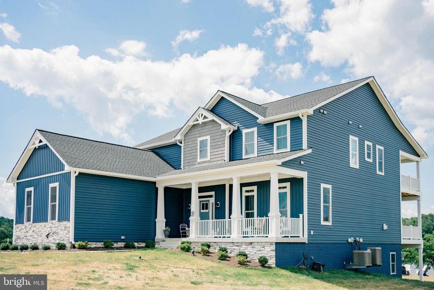 Here's your chance to own a brand new waterfront home at Lake Anna, Virginia that are currently under construction!  This luxury home is located in the most desirable subdivision on the private side of the lake: The Waters at Lake Anna, with its own pool and other amazing amenities. Whether you're looking for the perfect weekend escape, a relaxing primary residence, or an investment asset to generate passive income, this property will meet everyone's needs.  High speed fiber internet is available here, as well.  Construction has already started and will be fully completed in February/March 2025, in time for you to enjoy it for the upcoming season!  You'll enjoy breathtaking views from this premium waterfront property with 186 feet of water frontage and a sandy shoreline.  Located on a deep water cove perfect for swimming and floating in the lake.  The lot can accommodate a large boathouse as well!  This gorgeous craftsman style home will sit on 4.371 acres and will be constructed by award winning custom home builder, Built Right Homes.  A top notch local builder!  Open floor plan perfect for entertaining your family and friends.  3 bedrooms, 2.5 bathrooms and an office with full length covered balconies. Office could be a potential 4th bedroom.  Relax in over 4,900+ spacious square feet with amenities galore, including a gas fireplace with shiplap, Moen faucets, soft-close hardware and engineered hardwood flooring throughout the main level.  Gourmet kitchen with shaker style cabinets, quartz counters, stainless appliances, farmhouse sink and a large walk-in pantry is open to the dining area and family room.  The large primary bedroom features a walk-in closet with wood shelving, free standing tub, tile shower and a double vanity.  There is plenty of room to expand in the full unfinished walkout basement or in the large room above the garage! Tankless water heater and a 3 car loading garage.  Enjoy sitting on the covered front porch or relaxing on the multi-level covered back decks that will overlook the water.  Photos are not exact but a similar home is planned, and the home pictured has been sold.  The Waters at Lake Anna offers multiple common areas and amenities, including an in-ground pool, clubhouse, sandy beach, boat slips, a boat ramp, tennis court, basketball, pickleball and playground.  Excellent location: just 5-10 minute drive to groceries, restaurants, ABC, nail salon, vet clinic, Lake Anna Taphouse, coffee, The Yacht Club and more!  See full list of Construction & Design Features in MLS documents section.  Short term rentals are permitted!