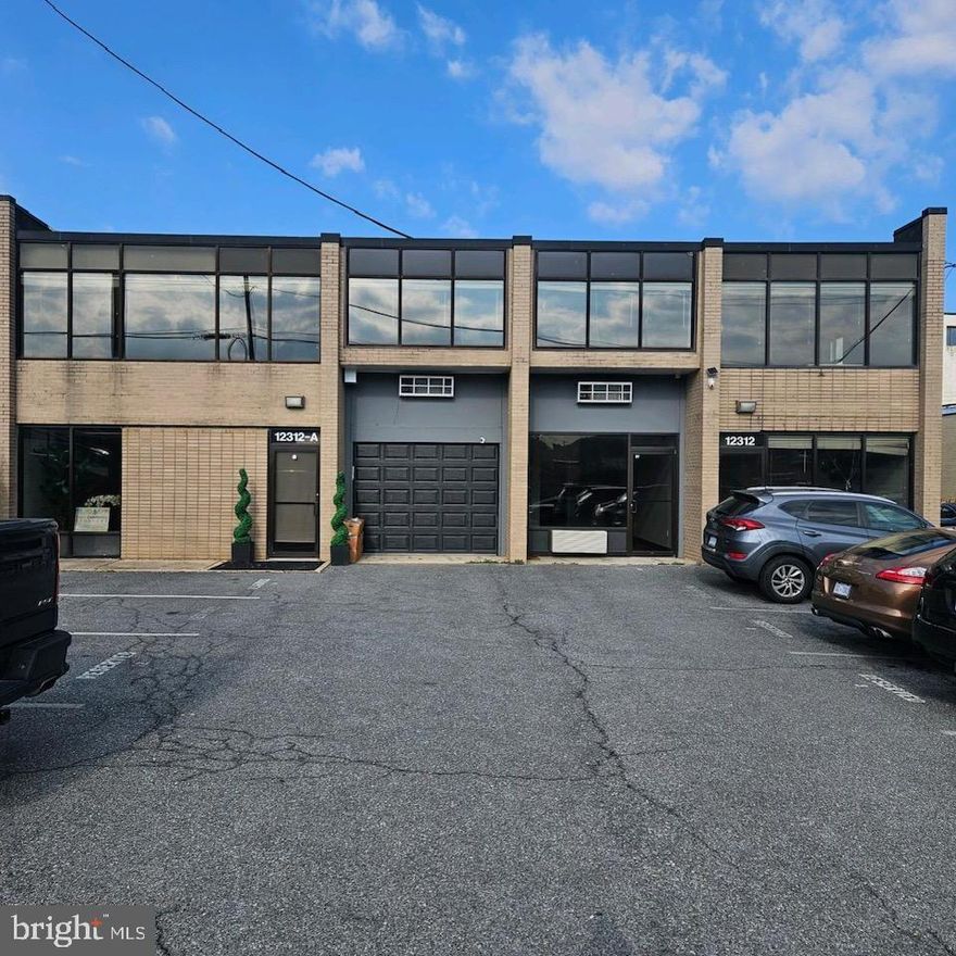 A total of 4 units each approximately 2,000 -3000 square feet with 14 parking spaces.  Great location,  several bathrooms, conference rooms and some warehouse.