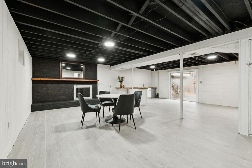 28 Ridgemore Circle | Fredericksburg, VA 22405
 
Welcome to one of the largest and most beautifully renovated brick homes for sale in the Spring Valley subdivision of Fredericksburg, VA 22405. Located in a quiet, established neighborhood with no HOA, this impressive property offers over 2,600 square feet of fully finished living space and combines timeless charm with high-end modern upgrades in a commuter-friendly location near I-95, Route 1, Downtown Fredericksburg, Quantico, and Mary Washington Hospital.

This spacious home features three completely renovated bathrooms (2025), each showcasing ceramic tile floors and custom-tiled showers for a clean, contemporary look. The main-level hardwood floors have been fully restored to their original beauty, creating warmth and elegance throughout the home. The fully renovated main kitchen (2025) includes quartz countertops, updated cabinetry, and modern finishes perfect for daily living and entertaining.

A standout feature is the second kitchen in the walk-out lower level, complete with a butcher block countertop and direct access to the patio, making it ideal for multi-generational living, entertaining, in-law space, or rental potential. The lower level also offers a large bonus room that functions as a non-traditional 4th bedroom (NTC), providing flexible space for guests, a home office, or gym.

Enjoy cozy evenings with two fireplaces — one wood burning on the main level and one electric on the lower level — while the brick exterior and single-car garage add both durability and convenience.  The opportunity to create your own backyard oasis exits with the patio, deck, shed and firepit which back to a partially wooded view which abuts to a creek.  As one of the largest homes in the neighborhood, this property delivers space, versatility, and long-term value.

If you’re searching for a brick home for sale in Fredericksburg VA with no HOA, two kitchens, garage, and finished basement, 28 Ridgemore Circle is a rare opportunity.

Schedule your private showing today and see why this exceptional Fredericksburg home stands out.