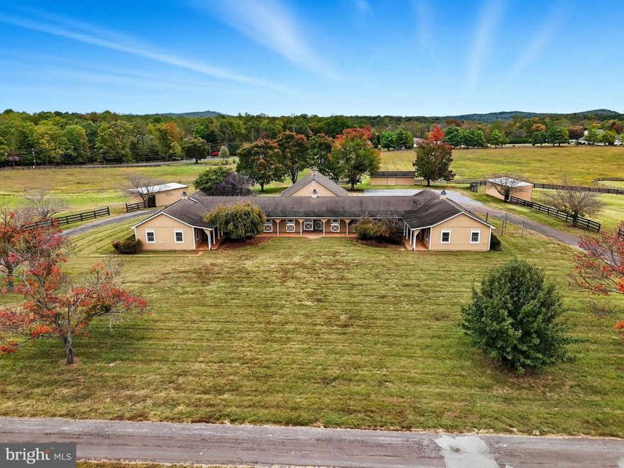 Opportunity Awaits! Ideal turnkey equine-oriented property for an active boarding and/or training facility on 14+ acres.  Enter down a gorgeous cherry tree lined driveway to the barns and indoor/outdoor arenas. The stable side contains 14 fully matted stalls across two barns - 8 in the main barn and 6 in the addition. Complete with two wash stalls, complete with hot/cold water, two large tack/feed rooms (one of which is heated), hay loft, half bath and a 1-2 Bed/1 Bath apartment.  The indoor arena offers 160x80 sq/ft of well-lit space and an adjoining 24x36 annex with two offices/bedrooms, one full bath, large common/lounge area, utility/laundry, kitchenette and oversized plexiglass windows allowing for comfortable viewing.  The indoor area opens directly onto a 150x150 outdoor arena, complete with covered gazebo. 6 separate fenced paddocks, several with run in sheds and water run to most.  Well thought out driveway system ensures you'll have plenty of room to park and never had to back your trailer up. The stables and the arena both offer 50-Amp RV hookups for visitors, vets, etc.  A short trailer ride to incredible trail systems ... 15 minutes to Culpeper, 20 minutes to HITS and close to several Hunt Clubs. Looking to build your home close by? Additional adjacent 10-acre estate lot available for sale. Don't miss your opportunity.