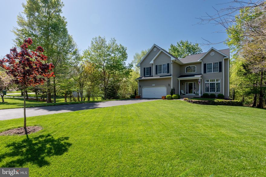 This is the one that you have been waiting for—pride of ownership is obvious! Lovely home on a cul-de-sac, with private deck and backyard that looks out on wooded area .Beautifully landscaped yard, large enough for a family football game or bocce ball tournament. Everything in this home is top of the line. Board and batten in the foyer. Renovated kitchen including large island with storage and built-in wine rack. Granite, subway tile and stainless steel appliances. Enjoy family meals in the large, sunny breakfast room. Updated lighting throughout and every bathroom has been upgraded. Gorgeous, professionally-finished basement with bedroom, full bath, kitchenette, gas fireplace, rec room, separate space for an office, and huge storage area. Basement could be secondary living suite. Long and flat driveway provides lots of parking. Beautiful flowering trees. Open concept. Hardwood throughout the 1st floor. This home has many bump-outs. Original Owner has taken loving care of the home. Enjoy living in Wildewood with the many parks, pools, and walking/running paths.  New Roof and New Water Heater.