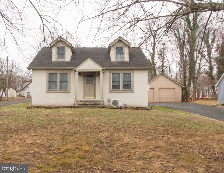 This charming Cape Cod-style home, built in 1946, offers 3 bedroom 1 bath. The interior features a traditional floor plan with hardwood flooring throughout, enhancing the warmth and character of the home. The combination kitchen and dining area is perfect for gatherings, while the full basement provides ample storage and laundry.  Set on a generous 0.36-acre lot, the property boasts a serene wooded backdrop, ensuring privacy. Parking is convenient with an attached carport and a detached garage. This home benefits from proximity to local parks, schools, and essential public services, fostering a strong sense of community. Enjoy the convenience of nearby amenities while relishing the quiet charm of this delightful property.