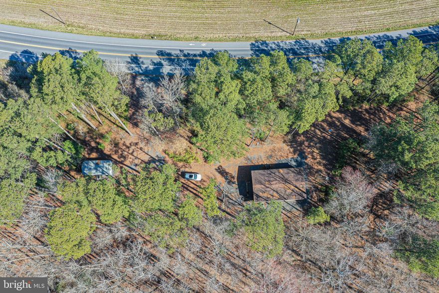 **Multiple Offers. Seller asking for best and finals due in by 11/27-Monday by 5pm** Welcome to the Outdoor Lodge Place home located on a large 2.6 acre lot that backs up and is surrounded by an additional 1.4 acres of forest conservation area giving all the privacy you would ever want in Worcester County.  The 3 bedroom 2 bath rancher style manufactured home gives a nice open feel as you walk in. Home does transfer a paid in full 1 year maintenance contract for the HVAC and plumbing as they were just inspected and serviced. There is a good size shed adjacent to the home that can be used for a small work shop and or storage. Just a short 10 minute ride into town for food and shopping. Multiple public hunting areas are close by along with George Island Landing if you want to put the kayak or boat in the Chincoteague Bay to explore both Assateague Island National Seashore on the Maryland side or head south to the Chincoteague, VA side. Great fishing and always fun to check out the wild ponies.. This may be the perfect place to call home if you're looking to be off the grid a little bit but not too far. Make sure to check out the full video tour attached to this listing. Seller says bring all offers!