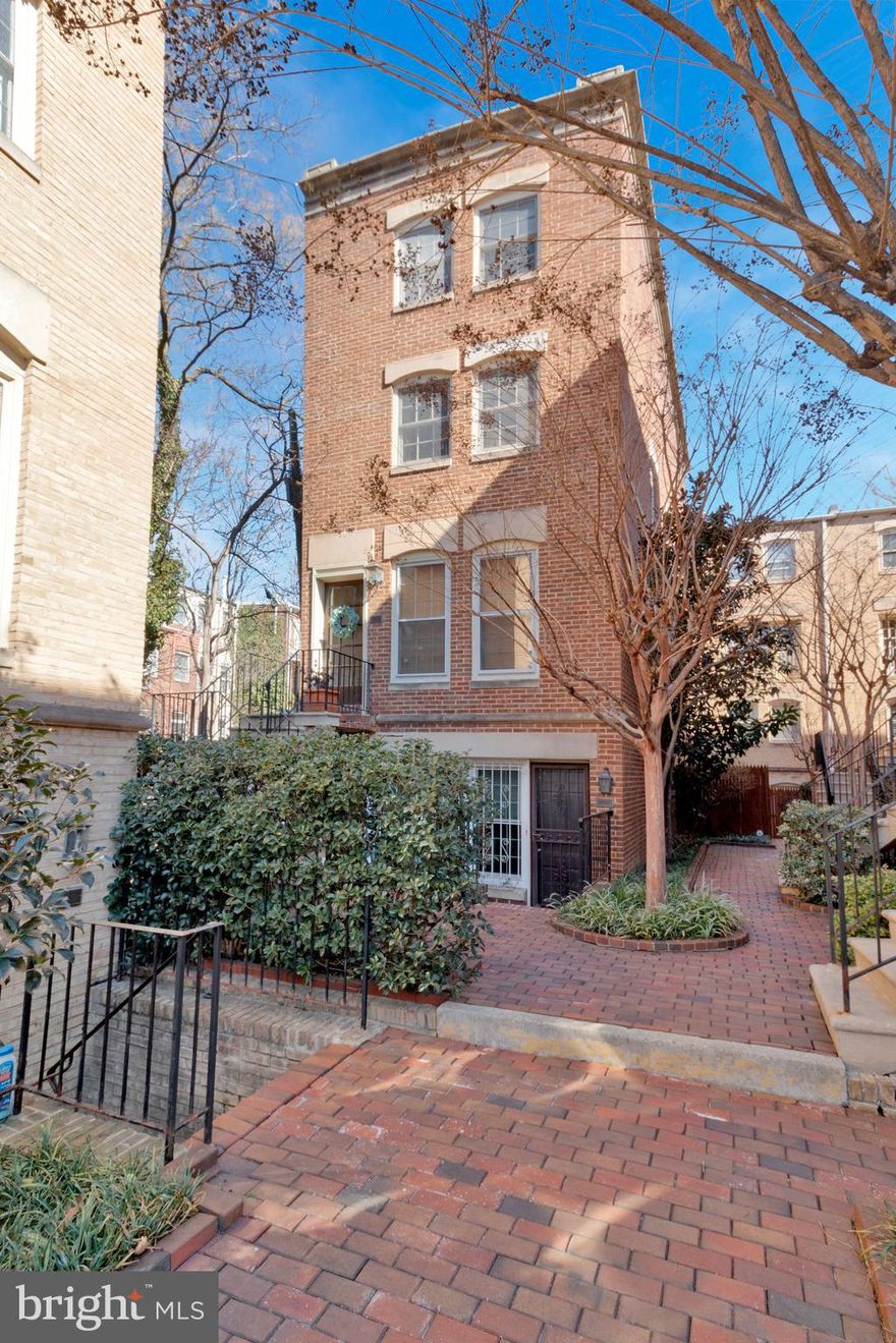 Welcome to 200 Justice Court NE #39, an exquisite 3-bedroom and 2.5-bath two-floor condominium offering a rare combination of urban convenience and a peaceful retreat. This remarkable property features easy PARKING and is ideally located just a block away from the Hart Building and the Supreme Court.

Tucked into a serene private courtyard, the home is elevated above ground with no neighbors to the side or above, ensuring a private and tranquil lifestyle amidst vibrant Capitol Hill. The inviting living room hosts a charming wood-burning fireplace, surrounded by a wall of windows that fill the space with natural light. Decorative chair rail and hand-painted wallpaper add a touch of elegance to the first floor.

The kitchen, thoughtfully renovated in 2024, showcases all-new custom cabinetry, Bosch appliances, and a stylish Quartz island with seating. Adjacent to the kitchen, a bright and versatile bedroom provides flexible options for hosting guests, working from home, or additional sleeping accommodations. An updated half-bath rounds out the first floor.

Ascend the staircase to discover the primary bedroom, featuring large windows that bathe the room in light and an en-suite bathroom for added convenience. This spacious retreat easily accommodates a king or queen bed and includes two generous closets and a vanity area.

Down the hall, another well-appointed bedroom offers ample closet space and a picturesque view of the courtyard. An additional bathroom and a stacked laundry unit enhance the functionality of the upper level. Recent updates include a new HVAC system installed in 2021 and beautifully refinished wood floors throughout.

Justice Court is a beautifully landscaped community, exuding a private and intimate atmosphere while being just steps away from recreation at Stanton Park and convenient transportation options at Union Station, including Metro and Amtrak services.

This exceptional residence invites you to experience the perfect blend of modern living and historic charm in the heart of Capitol Hill. Don't miss the opportunity to make this beautiful and private home your own.

Please note: The address per DC Tax Records is 200 Justice Court #39, but the mailing and physical address is 200 Justice Court #B.