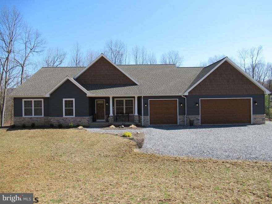 Stunning ranch with open floor plan on large lot in The Woods at Sand Ridge!  Kitchen has granite counter tops, Yorktown cabinets and marble back splash behind range.  Spacious master bedroom with sitting area.  Master bath with double sinks, soaking tub and walk-in ceramic tile surround shower.  Luxury vinyl flooring through out most of the house.  Trane heat pump with 2 stage system and propane back up.  Laundry on main floor.  Basement and garage floors plumbed for radiant heat.  Walk out basement plumbed for bathroom and kitchenette. Amazing covered composite deck off dining area overlooking woods!  You will want to spend most of your time on this awesome additional living space!  3 car garage with large storage/workshop area in back. Could even fit additional cars.  House is like new!  Call today before it's gone!