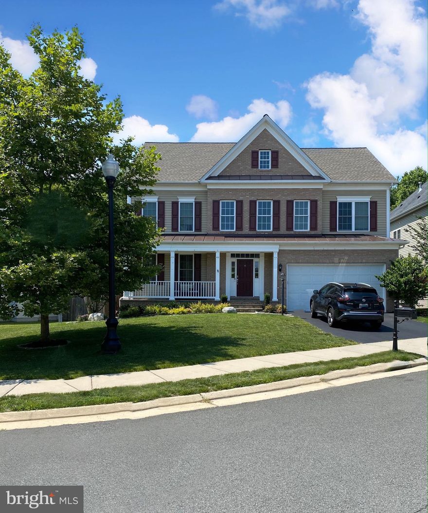 **PIX COMING FRIDAY!**This stunning 2-year young brick colonial in Stratshire Crossing has it all!! Huge and level backyard, fully fenced & backing to trees, deceptively large at 4,818 sq ft with 5 bedrooms and 4.5 baths on three finished levels. Gorgeous center island granite kitchen with Stainless steel appliances & double wall ovens. Gorgeous handscraped hardwoods in foyer, living & dining rooms.Plush carpet in huge great room/family room off kitchen with two story raised hearth stone fireplace.  Ample breakfast area with skylight leads out to the backyard patio area. Master bathroom has dual, split vanities and custom, rock pebble shower floor. Separate soaking tub and His & Her walk-in closets.  ALL closets thorughout have custom built-in organizers. Extra cabinetry & shelving in mudroom & garage. Laundry on upper level convenient to bedrooms. 3 additional bedrooms and 2 additional full baths on the upper level. Hardwood on upper level landing and hallway with upgraded memoryfoam carpet/padding in several rooms. Fully finished basement with wet bar, full bath and 5th bedroom.   Huge projection screen in movie area that's great for entertaining. Granite wet bar with on-tap drinks and walk-up french doors to the back yard offer plenty of light. Don't miss this amazing opportunity for luxury living!! Goshen Post, Mercer & John Champe HS.