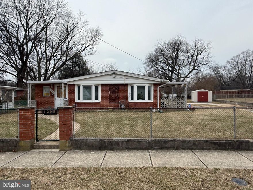 The ONE you have been waiting for.  Brick rancher on huge lot with shed and attached garage.  This house has it all.  Convenience walk to stores, restaurants, bus lines, etc.  Nice neighborhood.  This property is fully fenced has an entry gate at the driveway to keep your vehicles, boat or camper secure.  One level living at its best.  You are greeted by Covered Front and Side Porches!  Large entry foyer with coat closet and extra storage.  Nice size living room with gas fireplace and dining room.  Galley kitchen with all appliances and washer and dryer.  Two bedrooms with wood floors and ceiling fans.  The parquet floors are under the carpet in the hallway and living and dining room.  There is a bonus room where the furnace is with extra storage.  The garage is seriously oversize.  It offers a separate storage room, built ins and a whole house style fan to keep you cool.  Garage door opener.  Shed in the yard and super-size yard for your enjoyment.  Don't miss this one.  Pack your bags.