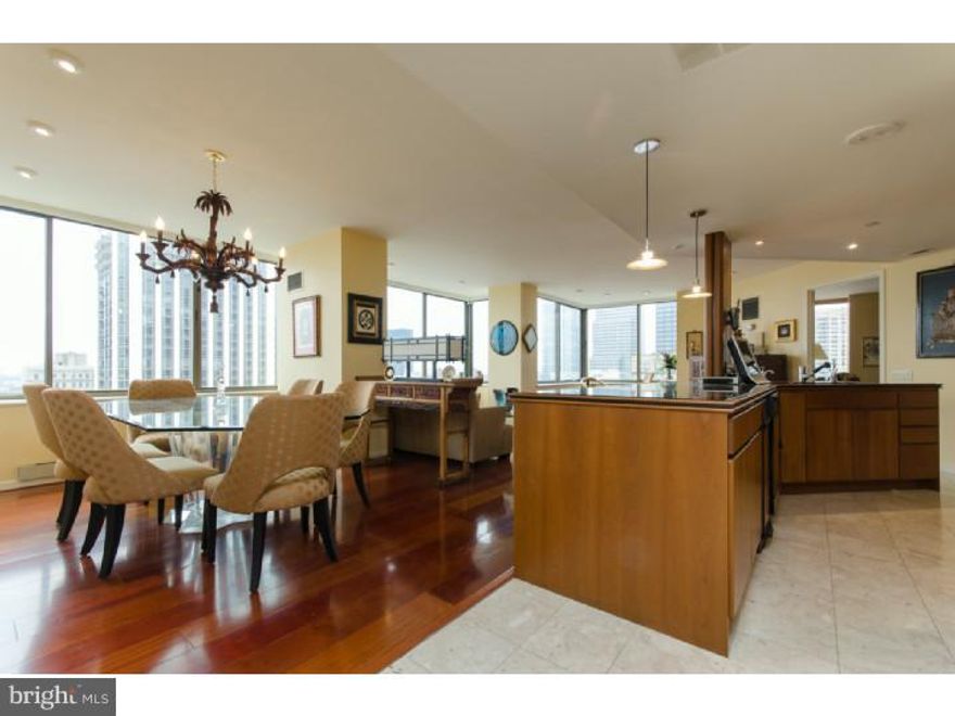 Unusual opportunity for a 3 bedroom, 2 bath in the Rittenhouse with a split floor plan. Master bedroom and bath on one side of the apartment, 2 bedrooms and bath on the other side. Open floor plan with views galore! West, South and North facing. Beautiful wood kitchen with granite countertops, pantry, electric cooking, double stainless steel sink. Wood floors throughout. The smallest bedroom is set up as a den with a built-in wall unit and desk. Marble tiled baths. Master bath has whirlpool tub, double sink vanity and stall shower. Terrific linen storage. Full-service 24-hour concierge, 24-hour room service, business center, housekeeping, chauffeur service, health club and indoor pool (additional fee) and on-site valet parking ($350/month). The Rittenhouse includes the LaCroix and Smith & Wollensky.