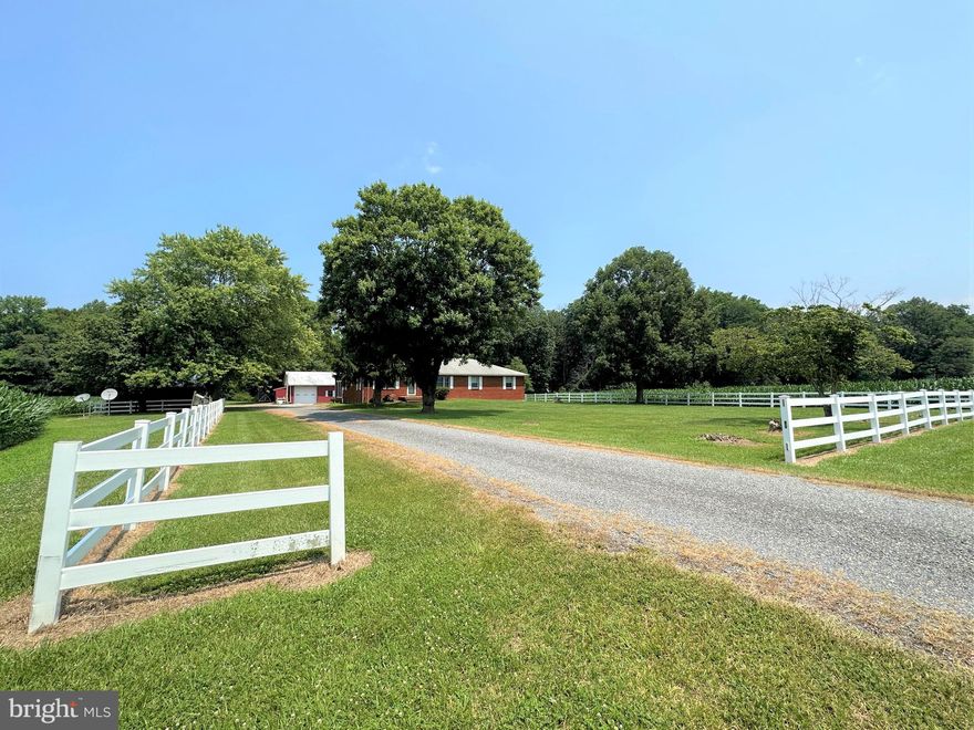 VERY MOTIVATED SELLER HAS REDUCED THE PRICE AGAIN!!   Look again at this RARE and UNIQUE property in Queen Anne’s County.  Very well maintained, spacious, move-in-ready brick rancher with basement sited on 43+ acres....2000+ sqft custom-built home features large bedrooms (primary bedroom with 2 closets &  updated bathroom), 3 full baths, kitchen with lots of cabinetry, separate dining room, living room overlooking farmland and mudroom/laundry with over-sized utility sink...Massive basement approx 1800 sqft, partially finished with woodstove and full bath.  Highlights of the home include slate foyer, a personal walk-in jacuzzi tub/shower, central vacuum and intercom system.  You can enjoy the view relaxing, or entertaining guests in the large, enclosed porch.  The home is bordered with a vinyl fence with an additional 3-car carport and a large 46x76 barn.  The barn features a large workshop, equipment storage area, 4 stalls and a tack room.  11+ beautiful acres of tillable land and 30+ acres woods loaded with White-tail deer, turkey, and other wildlife.  Convenient access to Middletown, Easton, Dover, and Bay Bridge.  Stop by to experience the view and serenity of this beloved homestead..