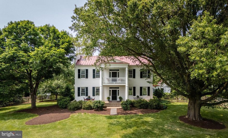 Rich heritage and diverse future potential combine at Bogota, a circa-1845 Greek-Revival manor on 52 acres with a quarter mile of frontage on the Shenandoah River! The main house has soaring 10-11' ceilings, rich millwork, & wood flooring throughout. Enter through an 11'-wide central foyer into stately living spaces: 17×32 living room with piano doors, 16×16 parlor, 11×16 study, 15x20 dining room--with original features such as 8" baseboards, chair rail, crown moulding, & built-ins. 16x17 kitchen with Sub-Zero fridge & gas cooktop. Upstairs are 5 bedrooms and 3 full baths including owner's suite with 15x20 bedroom, large walk-in closet, & fully tiled shower. This home boasts a remarkable 7 wood-burning fireplaces. Outdoor spaces also abound with 5 different porches! Multiple outbuildings, including large bank barn with 4 stalls & tack room, former summer kitchen and smokehouse. Riding ring and two paddocks with loafing sheds. 2nd dwelling on the property, "The 1756 House," adds 1,600+ sq. ft. of living space, 2 bedrooms & full bath. Surrounded by land under conservation easements, Bogota offers protected, uncompromised mountain views. Make it your equestrian estate, income producer (event venue, B&B), or private retreat!