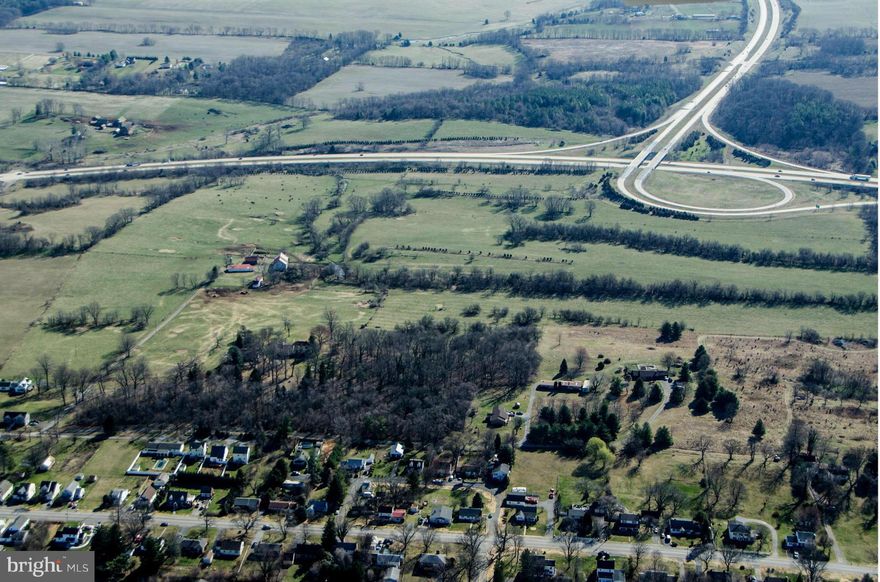 HUGE PRICE REDUCTION! GREAT DEVELOPMENT OPP 123+/- acres between the Charles Town  and Rte 340.Includes Belvedere Farm Manor Home, ca 1804, restored, elegant and livable. Small sections on west of 340 and bordering interchange cloverleaf. County zoned res growth. Land mostly level, mostly cleared. Frontage both sides of 340. Nice mtn views. Currently grazing land.