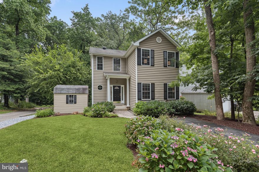 Welcome to this exquisite single family home nestled on a wooded lot in the desirable WATER privileged community of Herald Harbor!  This stunning residence offers a perfect blend of elegance, comfort, and privacy with updates throughout, making it an ideal retreat.  As you step inside, you are greeted by the open-concept floor plan seamlessly connecting the living, dining, and kitchen areas, creating a spacious and inviting atmosphere. Large windows and a sliding glass door flood the space with natural light, illuminating the rich hardwood floors and tasteful finishes throughout while providing a view of lush foliage and Severn River in the winter. The kitchen is equipped with stainless steel appliances, granite counters, and 42-inch white cabinetry. Whether you're a culinary enthusiast or enjoy simple home-cooked meals, this kitchen offers both functionality and style. The living and dining room combination is generously sized and offers deck access making it an ideal space for both entertaining and everyday comfort. The family room provides additional space for relaxing and unwinding or hosting guests. The primary bedroom is a true sanctuary, boasting a spacious layout and a tranquil atmosphere. It features a walk-in closet and a renovated en-suite bath with a double vanity and large subway tiled shower. Two additional generously sized bedrooms and a full bath conclude the upper level. The lower level is quite accommodating, offering walkout access to the backyard and a recreation room with built-in bookcases. Additionally, the lower level hosts the laundry room and a sizable storage room with shelving. Outside, beautiful landscaping and mature trees surround the property, creating a private oasis for relaxation and outdoor entertainment. The upper and lower decks provide ideal spots for al fresco dining or simply enjoying the serene surroundings.  The property also includes a fire pit area, storage shed, and additional parking space on the side.  Located in the sought-after neighborhood of Herald Harbor, this home offers easy access to the community beach and pier as well as nearby marinas. Convenient to commuter routes US-50, and I-97 to Annapolis, Baltimore, Washington D.C., Fort Meade, BWI Airport, and more. Property Updates: Finished lower level (made separate laundry and storage rooms), replaced HVAC, renovated primary bath, added fire pit area, interior paint, and landscaping.