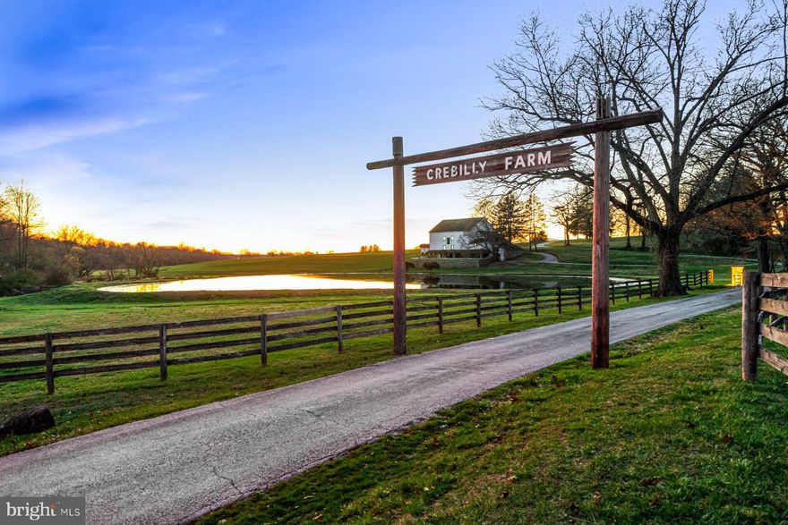 This spectacular 24.41 acre, subdivided and conserved parcel, once part of historic Crebilly Farm, features breathtaking views, surrounded by 3 separate conserved parcels. It features a private gated entrance winding past a charming stone chapel, meticulously crafted by artisan John Milner, and a historic Serpentine Stone bank barn with scenic views of the serene pond. The new owner may build the home of their dreams where a current ranch home exists. Enjoy your own access to the adjacent 206 Natural Lands Trust acres owned by Westtown Township, providing for trails and passive recreation in the future. Seize this unique opportunity to live in a serene, pastoral oasis in a coveted and convenient location, just minutes from renowned schools, shopping, restaurants, transportation, Philadelphia International Airport and more.