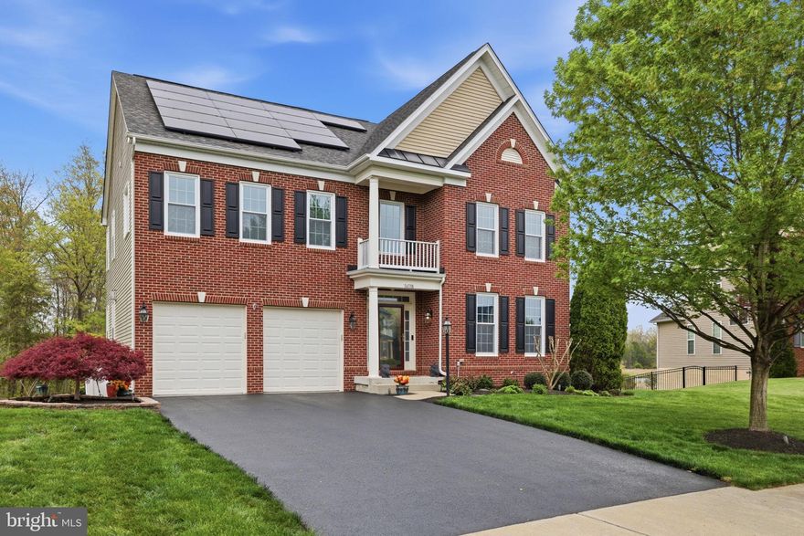 Set on a large lot backing to mature trees and walking trails, this home offers a rare sense of privacy and quiet while remaining centrally located. The natural tree line creates a meaningful buffer with no immediate rear neighbors, while brand new Thompson Creek noise-reduction tinted windows throughout the home further enhance the calm, creating a noticeably quieter interior environment than typically found in homes of this age.

Inside, hardwoods run throughout the home, complemented by a white kitchen with granite countertops, tile backsplash, and recently updated appliances. Major systems have been thoughtfully maintained, including a newer HVAC system (approx. 3 years) and additional insulation in both the attic and garage for improved efficiency. Durable epoxy on garage flooring.

Outdoor spaces are designed for both ease and enjoyment, featuring a stamped concrete patio, composite decking, irrigation system, and an invisible fence. The freshly paved driveway and exterior lighting further enhance both function and curb appeal.

The upper level includes a conveniently located laundry area, while the basement is currently configured for multi-generational living with accessibility in mind. Features include a chair lift (removable), a full bath with frameless shower and seating, custom tile work, barn door entry, and a private living area with separate washer and dryer—offering flexibility for extended living or potential rental use.

Additional highlights include a whole-house generator, new sump pump, and a spacious primary suite with two oversized walk-in closets, tray ceiling, and a well-appointed luxury bath. Solar panels allow for electric bills approximately $40/month.

A well-balanced home for those who value privacy, functionality, and a quieter living experience.