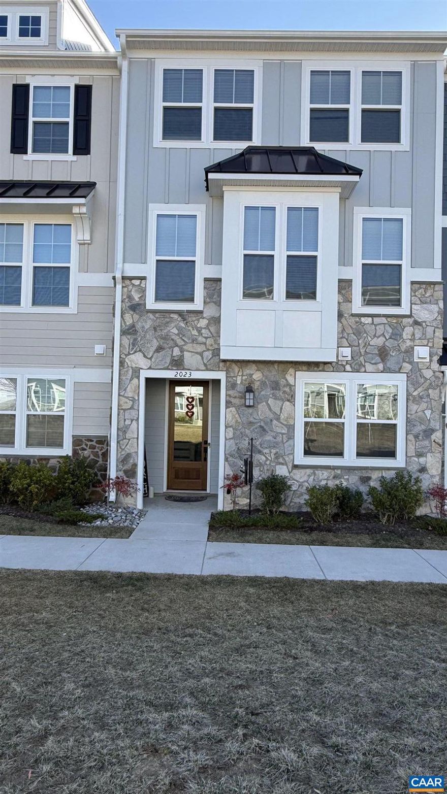 Like new, never lived in highly upgraded townhome under construction available on January 1st. 4 beds, 3 full & 1 half baths, Deck, 2 car garage open concept main level, and low-maintenance living creating ease in everyday life. Elegant custom features & light-filled open floor plan, hard floors in main level, spacious eat-in kitchen, granite counters, upgraded white cabinetry & luxury vinyl plank flooring, stainless steel appliances, (gas cooking) & a large deck. The spacious owner?s suite includes walk-in closet & private en-suite bath. Large two car garage and large driveway for off street parking. Neighborhood features green space, walking paths, picnic tables. The townhome is located near The Hollymead Town Center, NGIC, Sentara and the airport.