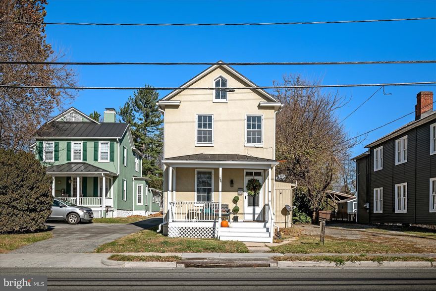 This Very charming  1910 East Main Street Vintage Home is  well preserved, with many of its original architectural features still in place. There are 9+ foot Ceilings on the main level. Every room has old pine floors,6" base molding original doors with the old timey doorknobs and a wonderful tucked away back stairase that leads to a cozy third bedroom. Listen to the rain on the metal roof. In the last 5 years it has been totally refurbished and repainted.  The gutters were also replaced at this time. The HVAC System is just a few years old and the heat is Natural Gas. The kitchen has been updated and has lots of nice cabinets.  There is a formal dining room with room for all of your dining room Vintage furniture. You will enjoy the  newer back sunroom with a door that leads to the deck and private backyard. Here, there is also a well appointment newer  full bath.The Upper Level has three bedrooms.  Two of them are quite large and will accomodate your bedroom furniture and king sized bed. The full bath still has its original claw foot tub and original porcelain wall mounted sink. The floor in the bathroom is wooden. The private yard is quite deep and has lots of shade trees and shrubs. There is partial fencing and a sweet old outbuilding that does need some updating.Take a leisurly stroll from this well located home to the park, shops, retaurants and more. This warm and inviting home with its special features will win your heart ll  The Owner Cannot Settle on this home until the first of the new year.  This home is in The Flood Plain. It is very possible that with an elevation survey completed that it will no longer be considered flood plain.  It was considered to be years ago before The Town Run was modernized.